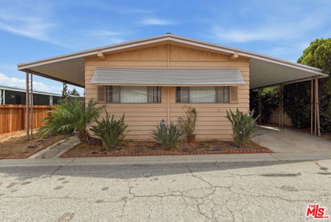 Photo of 2601 E Victoria Street #99, Compton, CA 90220 (MLS # 26873103)