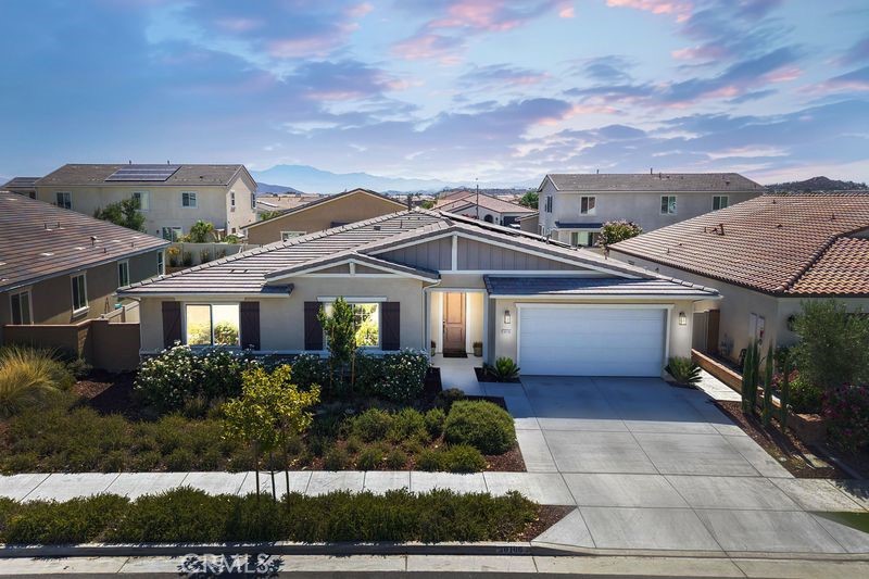 Welcome to your dream home in the highly sought-after Audie Murphy Ranch community of Menifee! This expansive 4-bedroom, 2.5-bath single-story energy-efficient home offers nearly 2,935 sq. ft. of beautifully designed living space on a generous 7,840 sq. ft. lot featuring mature fruit trees and thoughtfully landscaped outdoor areas perfect for entertaining or relaxing. Built in 2020, this home showcases an open-concept layout with soaring ceilings and dual living areas—ideal for both entertaining and everyday comfort. The chef-style kitchen features granite countertops, an oversized center island, walk-in pantry, and abundant cabinetry, making it the heart of the home. The spacious primary suite includes a spa-like soaking tub, separate walk-in shower, and a large walk-in closet. Three additional bedrooms offer flexibility for family, guests, or a home office.
WANT FREE ELECTRICITY? SELLER IS WILLING TO PAY OFF SOLAR CONTRACT WITH THE RIGHT OFFER! This energy-efficient home is powered by a solar system that generates up to three times the home’s energy needs, delivering substantial utility savings and long-term sustainability. Additional highlights include a 3-car garage, dedicated laundry room, and a low-maintenance backyard with custom concrete—ideal for outdoor dining and relaxation.
Located in one of Menifee’s most desirable master-planned communities, residents of Audie Murphy Ranch enjoy access to resort-style amenities including sparkling pools, soothing spas, a spacious clubhouse, Recreation room, scenic hiking and biking trails, and family-friendly playgrounds and picnic areas—all within close proximity to top-rated schools, shopping, and freeway access.
This home won’t last – PRICED TO SELL, DON'T MISS OUT! Schedule your private showing today!