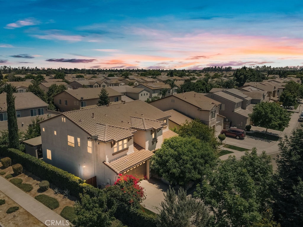 Tucked at the end of a quiet cul-de-sac in one of North Merced’s most highly sought after neighborhoods. This meticulously maintained 3,300 square foot home offers a rare blend of space, comfort, natural light, extra-high ceilings and a spacious three-car garage. Designed with both elegance and function in mind, the layout includes two generously sized living rooms, a formal living room for entertaining and a comfortable family room for everyday living. Two dining rooms, one formal and one casual— both overlooking the beautifully landscaped backyard and charming gazebo, creating shade and the perfect setting for any occasion. At the center of it all is a custom kitchen with handcrafted cabinetry, premium finishes, bar seating and plenty of space to cook, gather, and connect. Upstairs the expansive primary suite spans the width of the home and easily offers room for a private sitting area. Its spa-like bath features dual vanities, his-and-her walk-in closets, a soaking tub, and a luxurious walk-in shower creating your own private retreat. With four bedrooms, three full baths, and the option to add a fifth and sixth bedroom without sacrificing living space, this home offers both versatility and comfort. Every detail reflects pride of ownership in a location that combines privacy, convenience, and enduring appeal all with NO HOA. Conveniently located near shopping, dining, entertainment and both UC Merced and Merced College.