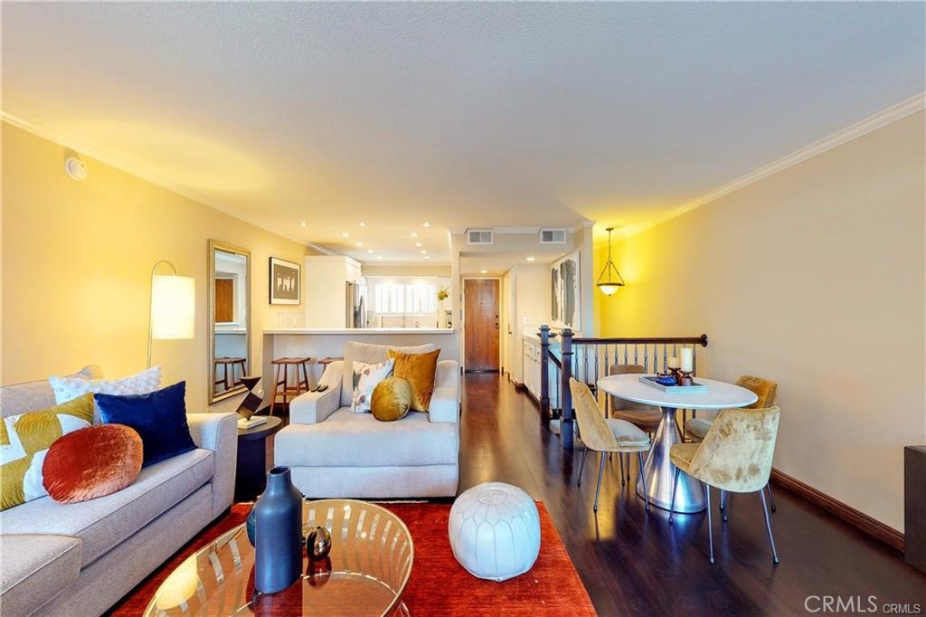 Welcome to this stunning townhouse-style condo located south of Ventura Blvd in Sherman Oaks. This spacious 2 bedroom, 2.5 bathroom unit offers a blend of comfort and convenience, perfect for modern living. The beautiful kitchen is equipped with stainless steel appliances, ideal for cooking enthusiasts. Cozy up by the fireplace in the living room or the second fireplace located in the main bedroom. All bedrooms are located downstairs, providing privacy and separation from the main living area. Enjoy a generously sized patio, perfect for outdoor relaxation and entreating. The building features an elevator for easy access to all levels, including direct access from the garage to the main floor of the building.
