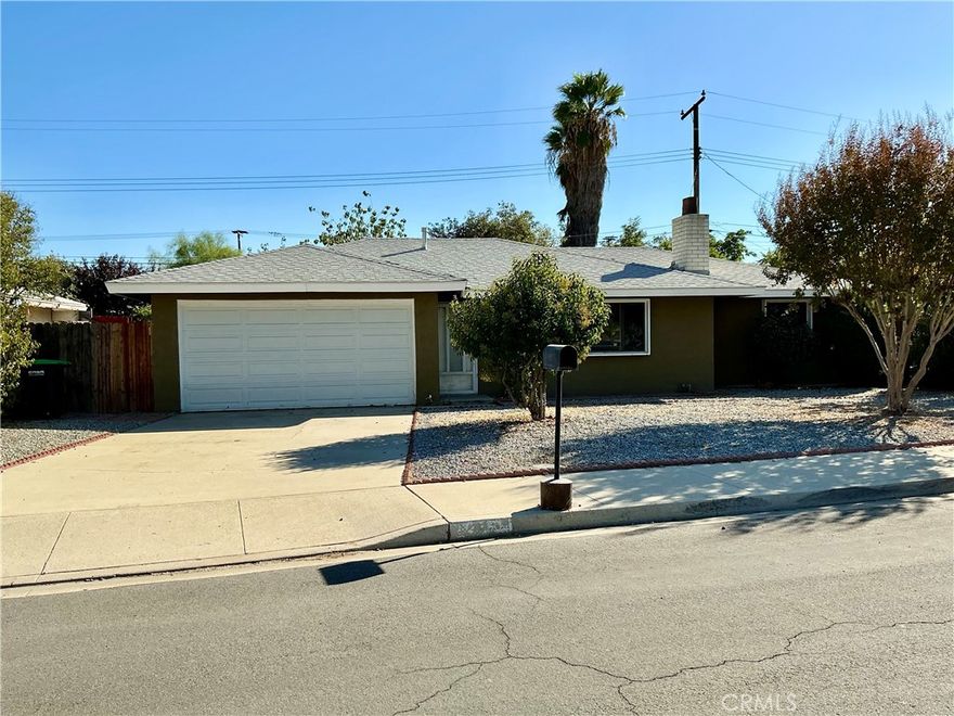 Nice first time buyer or small family home ready to move right in. Entry opens to the living room and presents an open floor plan with a brick fireplace. Kitchen has Granite counter tops and kitchen nook. New carpet in bedrooms, hallway, & New vinyl flooring. There is a large separate Laundry room and Granite threw out. Master bedroom has lots of closet space, master bathroom shower and vanity granite top. Hallway has separate closet for more storage room. Second bathroom has bathtub/shower with granite top vanity. Large backyard with low maintenance and citrus trees great for entertainment, Nice covered concrete slab patio. Possible side space for RV Access. Low Tax rates and No HOA. House is close to good schools and shopping areas. Come see this, it will go fast.