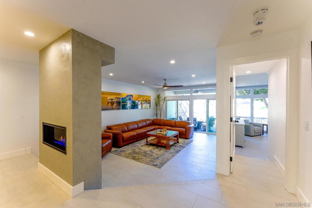 This furnished gorgeous waterfront end Condo is located in the exclusive Coronado Cays community, across from Silver Strand State Beach, where you may find yourself strolling in the early sunrise hours, catching some waves, enjoying the acrobatic kite surfers and dolphins who frequent the local surf break or taking a sunset stroll with your loved ones. Coronado Cays is located close to Loews Coronado Bay Resort and Hotel del Coronado. Coronado has an excellent variety of restaurants and is just a bridge away from many San Diego attractions for your family. This unique downstairs 1650 sq ft corner unit sleeps 6 and features stunning updated decor, with 2 beautifully decorated bedrooms and 2 full baths. You will find premium Thermador appliances in the kitchen (including a gas stove) with a new washer/ dryer in the unit. The self-contained waterfront patio is equipped with a propane BBQ, a large outdoor dining table which seats 8 people and a cozy firepit. The living room boasts a state-of-the-art remote gas fireplace, automatic window shades and a sectional leather sofa from which you can watch programs on an 85" television. Other amenities include 1 covered carport space, a 32' boat dock, a community pool and jacuzzi, new AC, and automatic shades in the master suite (with adjustable beds) and a walk-in closet. This end unit condo affords a private, luscious side greenbelt and an enclosed private front patio. This is the perfect place to relax, get away from it all and to enjoy a vacation with your whole family. Rates may vary depending on the season and length.