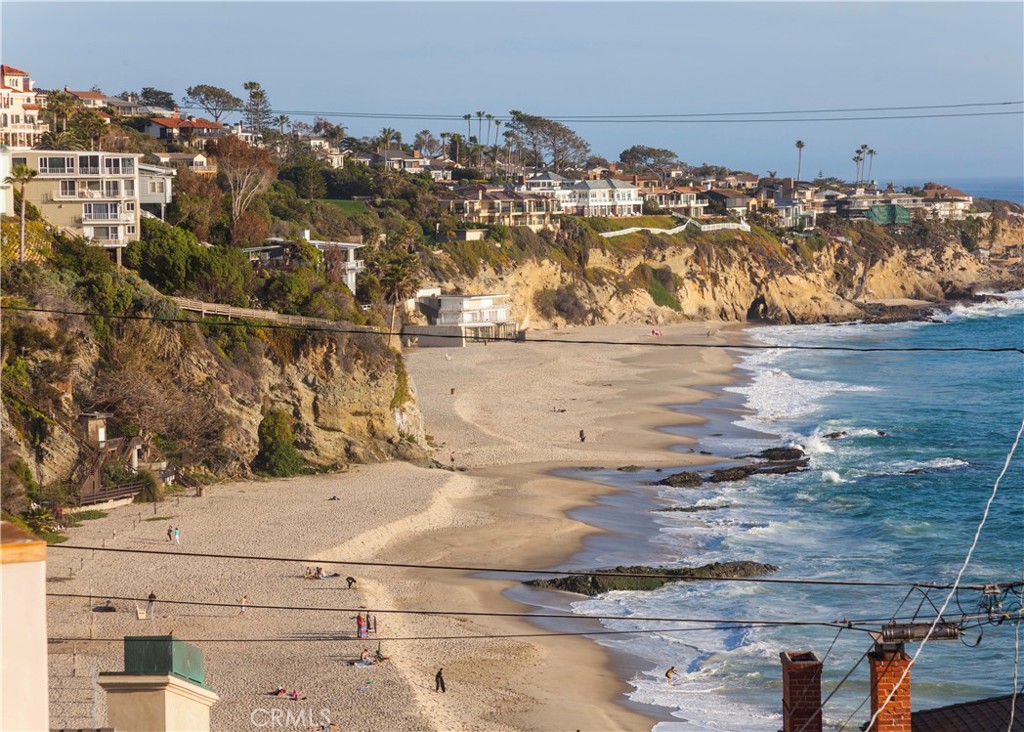A rare opportunity awaits at 31868 Circle Drive—this beautifully reimagined ocean-view home, perched above Thousand Steps Beach, will be available July 1st following a complete high-end remodel inside and out. Set on the exclusive ocean front street of Circle Dr., this 2-bedroom, 2.5-bathroom contemporary gem has been thoughtfully upgraded with all-new flooring, windows, and a sleek modern kitchen featuring new appliances and finishes. Every bathroom has been fully renovated, while a state-of-the-art Sonos audio system with invisible in-wall speakers offers whole-home streaming. The open-concept living space boasts soaring ceilings and expansive ocean vistas, flowing seamlessly to a balcony with dramatic north facing ocean views —perfect for enjoying stunning sunsets over Catalina. The primary suite includes a spa-like bath and private balcony with whitewater views. Additional features include new air conditioning, a two-car attached garage with a new door, and extensive exterior enhancements including fresh paint, new landscaping, outdoor furniture, and a built-in BBQ for elevated entertaining and an outdoor shower. With private access to Thousand Steps Beach and a location just moments from Laguna’s best dining, art galleries, and the free trolley, this turnkey home offers the ultimate in refined coastal living.