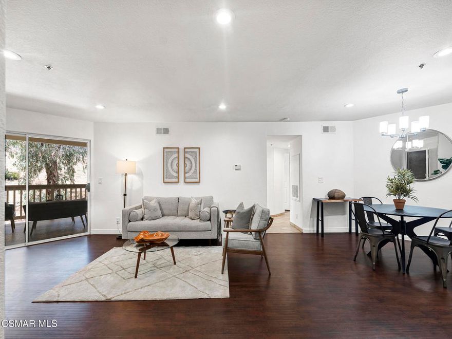 BOM!  Buyer could not perform. 2nd chance to make this yours! Welcome to this upgraded 2 bed, 2 bath CORNER-unit condo located on the coveted Valley View side of the sought-after Shadow Ridge community in Oak Park. This inviting, freshly painted home features rich engineered hardwood flooring and modern recessed lighting. You'll also find stylish lighting fixtures throughout and a beautifully updated kitchen with quartz countertops, matching backsplash, and stainless steel appliances. Both bedrooms are generously sized, and the primary suite offers a large walk-in closet, ensuite bathroom, and direct access to a private deck with peaceful hillside views. The home also includes in-unit laundry, dedicated covered parking, and ample guest parking nearby. Enjoy RESORT-style amenities including pools, sauna, tennis courts, onsite park, and more. HOA dues include expanded cable with HBO, WiFi, and high-speed Internet--an estimated $200 monthly value. Set in a tranquil location surrounded by nature, yet conveniently close to dining, shopping, and everyday essentials. Located within the award-winning Oak Park school district, this home offers a perfect blend of comfort, style, and convenience!