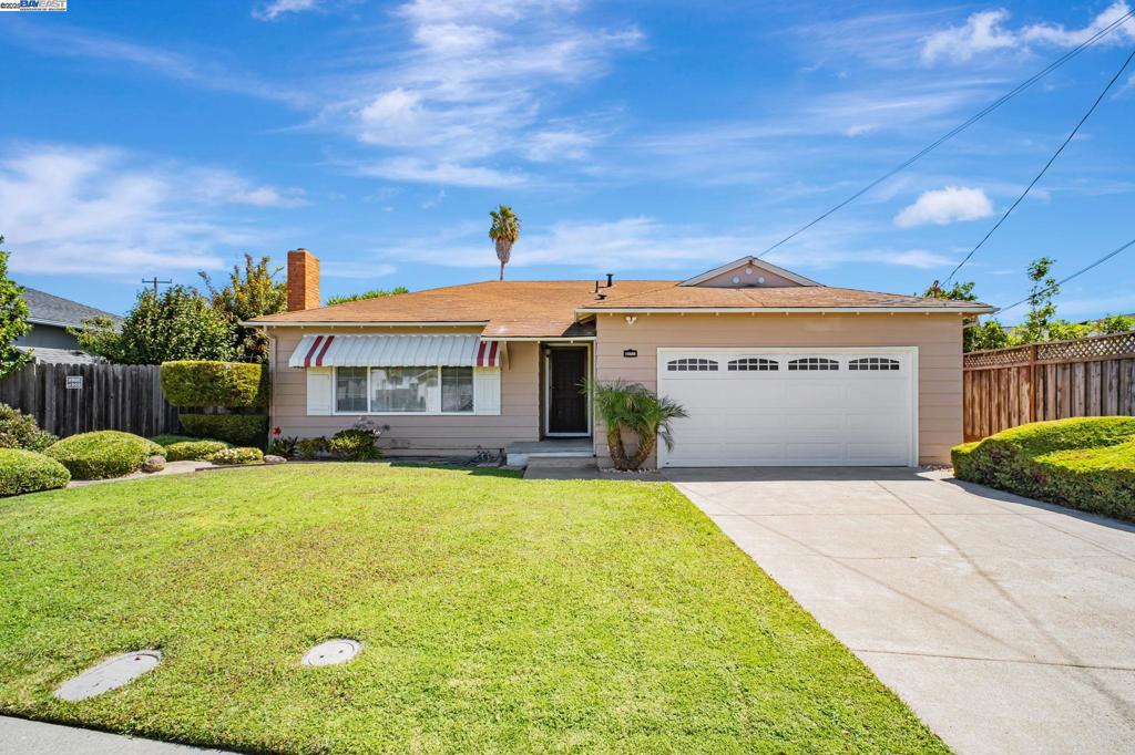 Welcome to 15586 Via Madeline – a well-maintained 3-bedroom, 2-bathroom single-family home nestled on a generous 7,015 sq ft lot in the heart of San Lorenzo Village. This 1,348 sq ft residence offers a functional layout with hardwood floors throughout, abundant natural light, and comfortable living spaces designed for everyday enjoyment. The living room features large windows and a cozy fireplace, creating a warm and inviting atmosphere. The kitchen is equipped with an electric range, breakfast bar, and plenty of cabinet space, conveniently adjacent to the dining area and a flexible bonus nook The primary bedroom includes two closets and an en-suite bathroom with an updated vanity. The secondary bathroom also features a refreshed vanity, while both shower areas offer potential for your own personal updates. Step outside to a beautifully landscaped backyard with mature trees, lush lawn, and a storage shed. The back yards offer privacy and plenty of room for entertaining, gardening, or relaxing outdoors. The attached two-car garage provides interior access and laundry. Located near schools, parks, and local amenities, with easy access to major commuting routes. A wonderful opportunity to own a move-in ready home with room to customize and grow. Open House 8/9 & 8/10 at 1-4pm