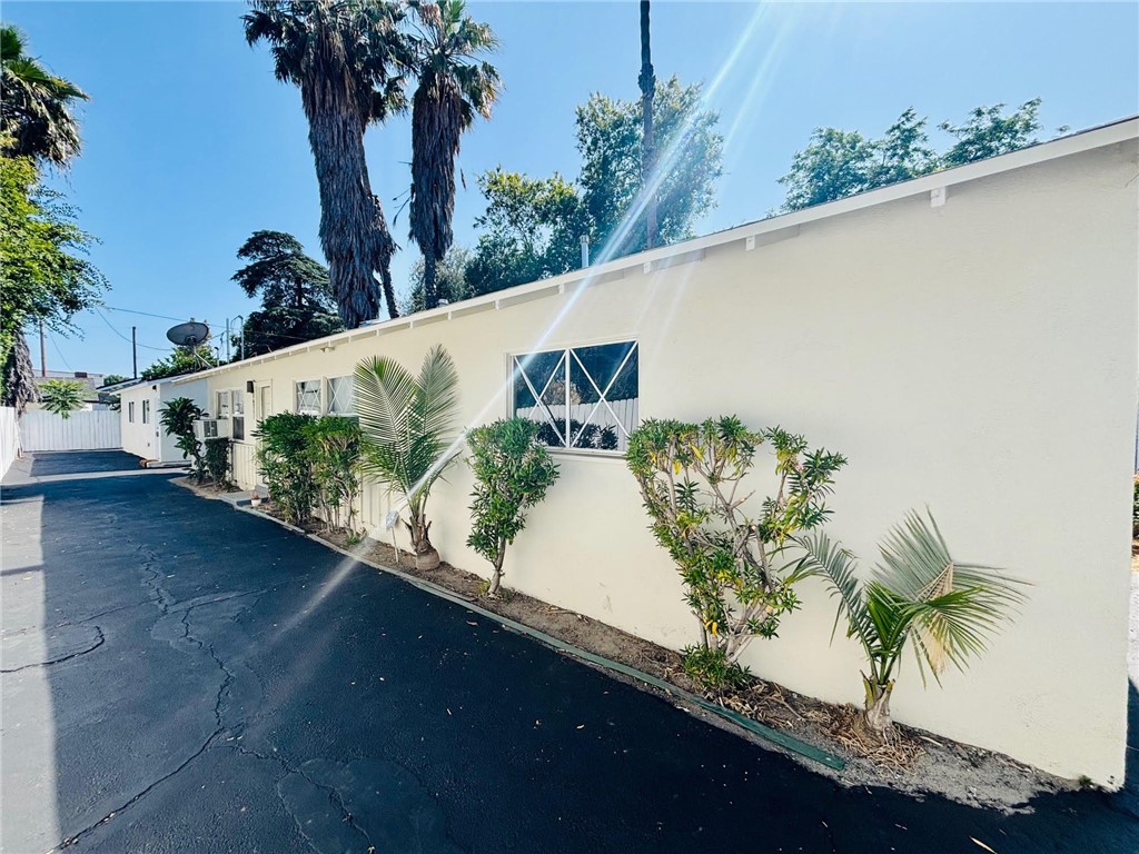 Stylish Van Nuys Rental Home. Single story, back unit. Wood flooring throughout. Large living room. Open kitchen w/ stainless steel appliance, fridge, granite countertops, and dark cabinetry. Guest bathroom off of kitchen. 2 large bedrooms. Wall a.c. units in each room. Huge private backyard. Multi-car parking spaces for unit. Rent at only $2,999 per month.