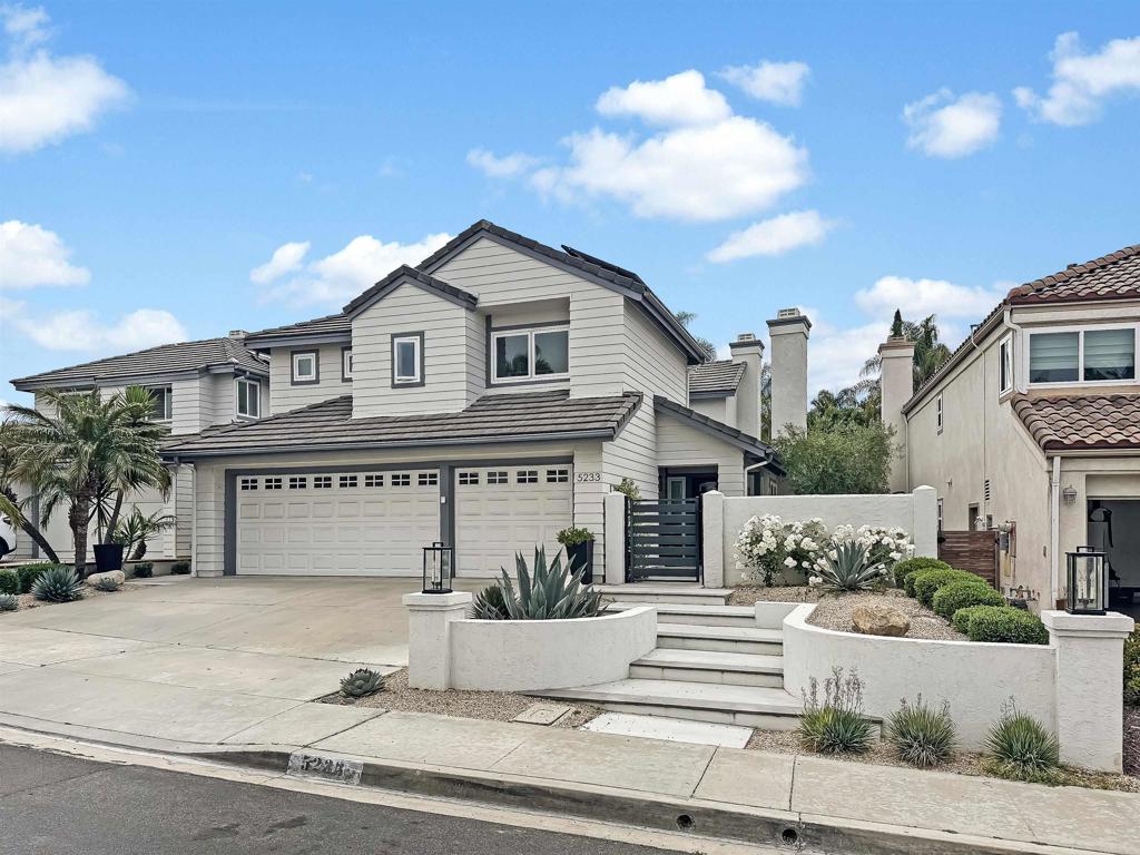 This completely remodeled Monteloma home on “the hill” in Tierrasanta blends modern design with timeless comfort. Step inside to light wood flooring that flows throughout the home, setting the tone for the thoughtful upgrades found throughout. The chef’s kitchen is the heart of the home, featuring quartz countertops, two-tone cabinetry, a wood island with waterfall edges, striking tile backsplash, and ample prep space. Just off the kitchen, the family room offers built-in cabinetry on either side of the fireplace—perfect for everyday living and entertaining. Surrounded by large windows filling the space with natural light, the dining room adds charm with barn doors and plenty of natural light, making it ideal for gatherings or flexible use. Upstairs, you’ll find four bedrooms and two remodeled bathrooms. The spacious primary suite includes built-in cabinetry and custom closets from The Container Store. The en suite bath is beautifully appointed with dark tile floors, a luxury vanity, and a tiled walk-in shower. Three additional bedrooms share a stylish hall bathroom with patterned tile flooring and subway tile in the shower. The backyard offers low-maintenance living with turf, a large patio for entertaining, string lights cascading overhead, and a built-in above-ground electric hot tub that seats 10. Out front, a gated private courtyard provides added privacy and the perfect spot to enjoy Tierrasanta’s incredible sunsets. All appliances in the home are newer, with everything replaced within the last five years. Additional highlights include a dedicated home office with built-in cabinetry, fully owned solar, and an attached three-car garage with epoxy flooring. Located just a short walk from the Tierrasanta Rec Center, this home offers convenient access to year-round activities including sports leagues, fitness classes, and summer Concerts in the Park. The center also features a swimming pool, basketball courts, playground, and baseball and soccer fields. Tierrasanta offers the perfect blend of community, convenience, and outdoor living. Located within the award-winning San Diego Unified School District, this family-friendly neighborhood is close to grocery stores, gyms, parks, and scenic hiking trails. Enjoy the best of the Southern California lifestyle with easy access to beaches, shopping, golf courses, and more—all just minutes from the I-15 and CA-52 freeways.