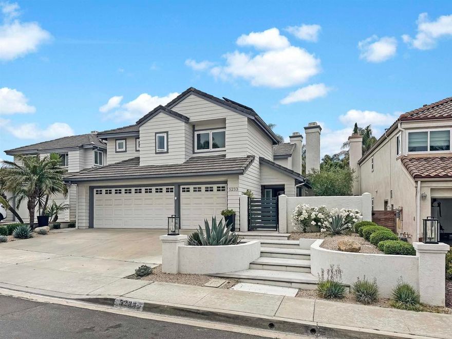 This completely remodeled Monteloma home on “the hill” in Tierrasanta blends modern design with timeless comfort. Step inside to light wood flooring that flows throughout the home, setting the tone for the thoughtful upgrades found throughout. The chef’s kitchen is the heart of the home, featuring quartz countertops, two-tone cabinetry, a wood island with waterfall edges, striking tile backsplash, and ample prep space. Just off the kitchen, the family room offers built-in cabinetry on either side of the fireplace—perfect for everyday living and entertaining.  Surrounded by large windows filling the space with natural light, the dining room adds charm with barn doors and plenty of natural light, making it ideal for gatherings or flexible use.  Upstairs, you’ll find four bedrooms and two remodeled bathrooms. The spacious primary suite includes built-in cabinetry and custom closets from The Container Store. The en suite bath is beautifully appointed with dark tile floors, a luxury vanity, and a tiled walk-in shower. Three additional bedrooms share a stylish hall bathroom with patterned tile flooring and subway tile in the shower.  The backyard offers low-maintenance living with turf, a large patio for entertaining, string lights cascading overhead, and a built-in above-ground electric hot tub that seats 10. Out front, a gated private courtyard provides added privacy and the perfect spot to enjoy Tierrasanta’s incredible sunsets.  All appliances in the home are newer, with everything replaced within the last five years. Additional highlights include a dedicated home office with built-in cabinetry, fully owned solar, and an attached three-car garage with epoxy flooring.  Located just a short walk from the Tierrasanta Rec Center, this home offers convenient access to year-round activities including sports leagues, fitness classes, and summer Concerts in the Park. The center also features a swimming pool, basketball courts, playground, and baseball and soccer fields.  Tierrasanta offers the perfect blend of community, convenience, and outdoor living. Located within the award-winning San Diego Unified School District, this family-friendly neighborhood is close to grocery stores, gyms, parks, and scenic hiking trails. Enjoy the best of the Southern California lifestyle with easy access to beaches, shopping, golf courses, and more—all just minutes from the I-15 and CA-52 freeways.