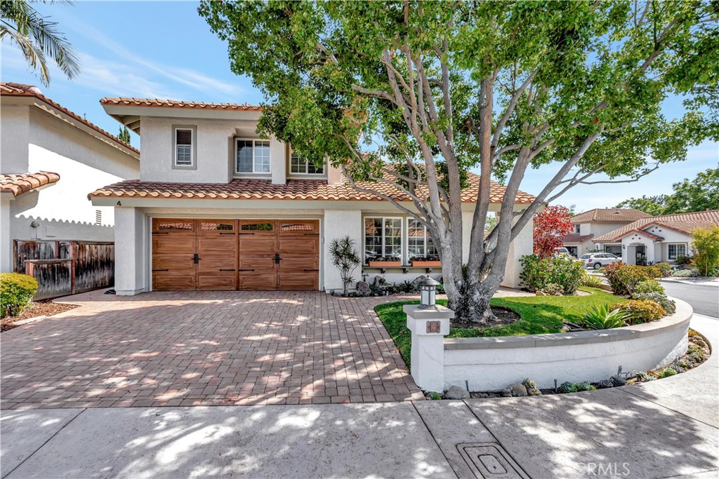 CORNER LOT WITH CURB APPEAL!!!! Welcome to an exquisite and pristine residence nestled on a coveted corner lot in the tranquil and highly desirable Vista Ladera community of Rancho Santa Margarita. This stunning 3-bedroom, 2.5-bath home exudes timeless charm and modern sophistication, perfectly positioned at the heart of RSM with seamless access to premier schools, parks, shopping, and the scenic lake.
Step inside to discover gleaming real maple hardwood floors that extend throughout the lower level, complemented by abundant natural light, elegant crown moldings, and beautifully encased windows. The thoughtfully designed floorplan offers distinct family and living rooms, each enhanced by dual sliding glass doors, crown moldings, and encased windows that invite effortless indoor/outdoor living.
Entertain in the gourmet kitchen featuring stainless steel appliances, antiqued cabinetry, a central island, and a charming breakfast bar perfect for casual gatherings. The professionally landscaped backyard is a personal sanctuary, showcasing a tranquil water feature, gas fireplace, built-in barbecue, and lush privacy—ideal for both serene relaxation and memorable entertaining under the California sky.
Upstairs, the generously sized guest bedrooms share a stylishly updated bathroom complete with a custom shower enclosure, granite vanity, and ample storage. The master suite is a serene retreat with stunning Saddleback Mountain views, a custom-built closet, and a brilliantly appointed ensuite bath. Beyond the visible elegance, enjoy peace of mind with new ductwork, whole house water filter, updated A/C and furnace systems, and a complete home repipe—ensuring comfort and reliability. This impeccable residence is the perfect harmony of luxury, comfort, and location, ready to welcome you home.