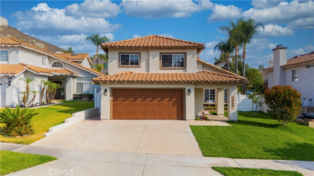 Fantastic purchase opportunity on this gorgeous remodeled 4 br 3 ba home located in the popular "La Paloma" at the Corona Ranch. Centrally located close to schools, shopping and freeways in a location convenient for commuting. Desirable floor w/ 1 br & 1 ba downstairs, 3 br 2 ba upstairs, formal living room, formal dining area, separate family room with fireplace, bright and open kitchen, upstairs loft/ den area, 2 car direct access garage, & fully landscaped backyard for entertaining. Completely updated w/new kitchen, baths, flooring, painting, fixtures, AC and landscape. Upgrades include fresh interior & exterior painting, brand new kitchen w/ nature wood solid wood cabinets w/black handles, high quality white/gold quartz countertop, matte porcelain subway tile backsplash, new GE microwave, GE 5 burner SS gas range, GE dishwasher, Moen disposal, sound damping solid wood decorative accents walls in kitchen, cabinet lighting, farmhouse sink w/apron, new 8mm, 9" LVP flooring, large format porcelain tile & marble mosaic tiles in bathrooms, marble tile shower flooring, large format porcelain tiles in shower walls and partial bathroom walls, new 36" single sink, 60" dual sink, & 72"dual sink vanities in bathrooms, tempered glass bathroom shower doors, humidity sensing exhaust fans, new waterproofing membrane and cement boards in shower walls, new 5 1/2" baseboards, window sill moulding, & interior door and closet moulding, 2 new dual pane windows in primary bedroom, 2 new custom triangle glasses over the living room & kitchen ceiling, all new interior & exterior doors, door locks, door frames, new closet doors & closet accessories, new 5-ton Rheem central AC unit w/Ecobee Smarthome thermostat (all AC components have a 10-year manufacturer material warranty & 1-year labor warranty), new 40-gallon Rheem water heater (6 year manufacturer warranty & 1-year labor warranty), new GFCI's and grounding all outlets, new switches, outlets, pendant lights, recessed lights & ceiling fan w/lighting kits, new garage overhead door motor w/lighting kit & remote, new water efficient kitchen sink faucet, bathroom faucets, and shower sets, new low flor toilets, all new plumbing sustem on the first floor bathroom and kitchen, upgraded laundry utilities including cold/hot water, sewer, gas & ventilation to the exterior, new automated sprinkler system, timer, drip system, new artificial grass with drainage, outdoor wall sconces, & new vinyl fencing and gate. Don't miss out!
