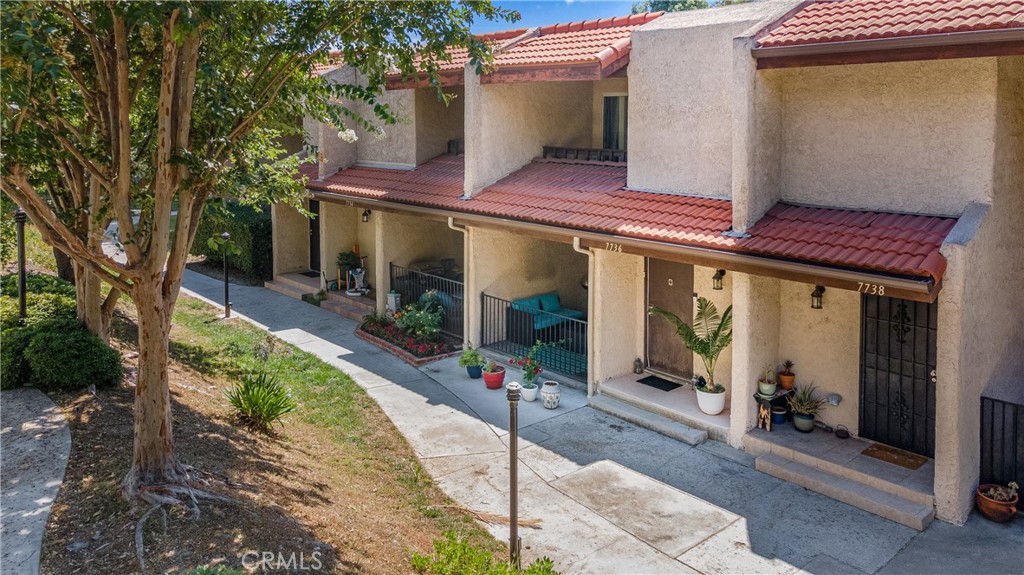 Welcome to 7736 Via Sorrento #32, a move-in ready townhome nestled in the highly sought-after Cabrini Villas community of Burbank. This beautifully maintained residence offers approximately 1,151 square feet of comfortable living space with 2 bedrooms, 1.5 bathrooms, a private attached 2-car garage, in-unit laundry, and a private patio and balcony with peaceful views. The bright, open-concept layout features vaulted ceilings, a cozy fireplace, and modern conveniences such as central air and heat. The community boasts resort-style amenities including 7 swimming pools, 4 Jacuzzis, multiple tennis courts, basketball and volleyball courts, a clubhouse, and a children’s park—perfect for families and active lifestyles. Residents also enjoy 24-hour security patrol, gated access, and HOA-covered services such as water, cable, sewer, and earthquake insurance. Conveniently located near parks, schools, and the vibrant Burbank dining and entertainment scene, this home offers the ideal blend of comfort, convenience, and community. With its turnkey condition and exceptional neighborhood features, 7736 Via Sorrento is a rare opportunity you won’t want to miss.