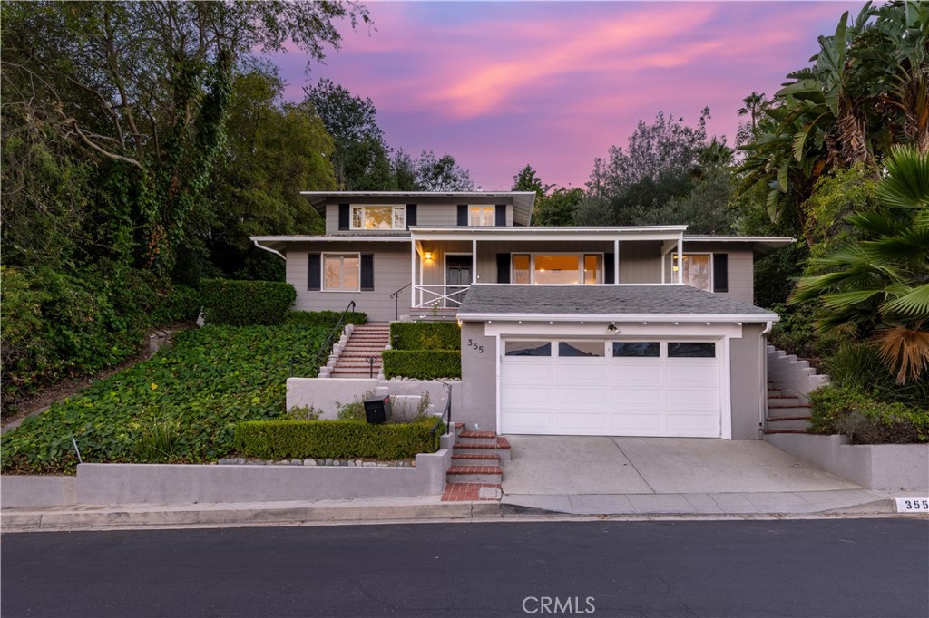 Located in the desirable San Rafael Hills, this charming Cape Cod–style home offers breathtaking panoramic views and thoughtful updates throughout. The formal entry opens to an elegant living room with a fireplace, French doors, and a separate dining area featuring built-in cabinetry, hardwood floors, and recessed lighting.
With a split-level design that highlights the sweeping foothill views, the home features an updated kitchen with custom cabinetry, granite countertops, and stainless steel appliances. The spacious primary suite includes dual closets, French doors, and a picture window framing the hills. The en-suite bath offers a double vanity with granite countertops, a separate shower, and an oversized jetted soaking tub.
Two additional bedrooms on the lower level share a full bath, while a comfortable family room with French doors leads directly to the rear patio. At the top of the property, a private terrace provides the perfect setting for outdoor entertaining and enjoying the surrounding views.
Ideally located in a sought-after Pasadena neighborhood, the home offers the perfect balance of convenience and charm. Just minutes from Old Town Pasadena, Caltech, the Rose Bowl, and top-rated schools, residents enjoy easy access to shopping, dining, and cultural attractions while still benefiting from the quiet, tree-lined streets and welcoming community feel. Quick freeway connections also make commuting to Downtown Los Angeles and surrounding areas effortless.