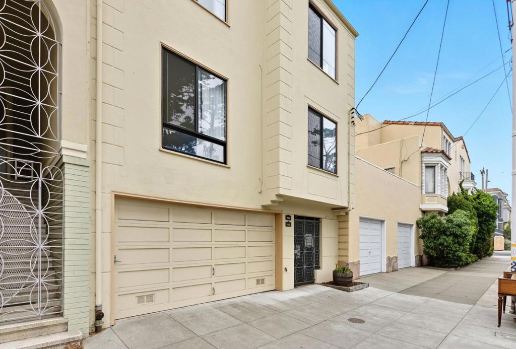 Discover the charm and VIEWS of the duplex at 5922 and 5924 Fulton Street. These two nearly identical floor plans are both 2 bed and 1 bath flats in San Francisco's highly sought after Outer Richmond neighborhood. Just seconds from serene Golden Gate Park and both lower (5922) and upper (5924) units feature views of Spreckels Lake! Step inside the gated entry to find an oversized garage on the ground floor with multi purpose options. The lower flat, 5922, features hardwood floors and is rented for instant income! The upper level flat, 5924 features plush carpet, and is vacant, ideal for owner occupancy or maximizing your investment by generating market rent. Both units feature large water view living rooms w/ mantled fireplace, modern eat-in kitchens with updated grey shaker cabinets, quartz countertops and a gas range with built-in microwave above. Bedroom layouts have two spacious bedrooms that share a remodeled bathroom with separate tub & stall shower, modern vanity and tile floor. The spacious backyard features a turf area, garden, and patio. With its prime location near scenic parks, and transportation, this duplex is an outstanding opportunity for homeowners and investors alike. Don't miss your chance to own a piece of Outer Richmond history.