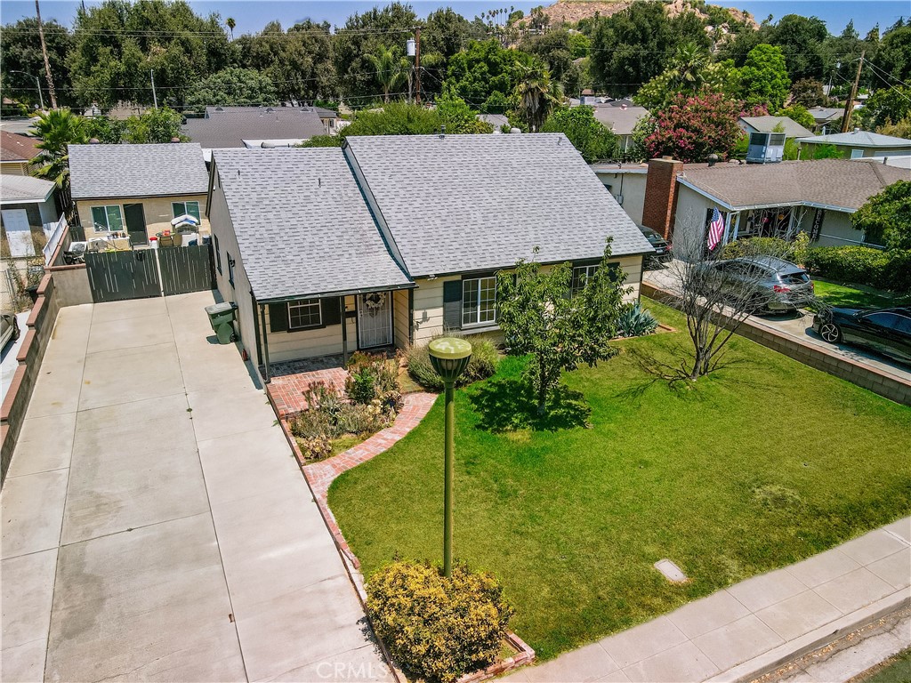 This property is more than just a home—it’s an investment opportunity in one of the most desirable neighborhoods near Trader Joe’s, Riverside Plaza and other local amenities. The main residence offers four bedrooms and two bathrooms, with the primary suite privately located in its own wing. The layout flows seamlessly through the main living area, wet bar, and an additional living space with its own bedroom, updated bathroom, and laundry room, creating the perfect setup for a private guest suite or rental unit with its own entrance. Beyond that, the property includes a detached one-bedroom, one-bathroom ADU that was previously rented for $1,600 per month, providing immediate cash flow potential. Whether you’re looking to offset your mortgage, generate steady rental income, or create a multi-generational living arrangement, this home offers flexibility and long-term upside in a location that will continue to attract strong demand. The main home is 4 bedroom 2 bathrooms with the private entrance to the primary suite.