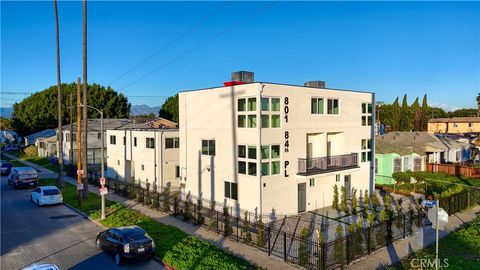 Photo of 801 E 84th Place #1/2, Los Angeles, CA 90001 (MLS # OC26097321)