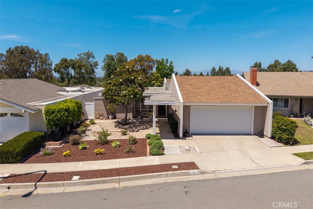 Located in the quiet hills of Turtle Rock, this detached, single level, 4BR sits on an elevated lot overlooking the community park & enjoying open views of the surrounding hills & trees. Tastefully upgraded with hardwood floors, Milguard windows & doors (incl 5 custom sliders) with extensive use of plantation shutters. Enter to a sophisticated living room w/marble faced fireplace w/custom mantel & added crown molding. Formal dining room enjoys open views to dual patios. The family room & adjoining kitchen can be separated by added barn doors. Kitchen has been updated w/custom cabinetry, matte finished white corian counters & all new stainless steel appliances. All bedrooms enjoy cathedral ceilings & mirrored closet doors. Both baths have been updated w/tile floors & granite counters. Added storage & laundry sink in garage. Drought tolerant landscape in front & back. Steps to community park & resort like HOA community amenities incl Olympic size pool, tennis & basketball courts & playground. Walk to award winning University High School & Turtle Rock Elementary School. Low tax rate. No Mello-Roos. Low HOA dues. This is the best price for a detached, 4BR in Turtle Rock.