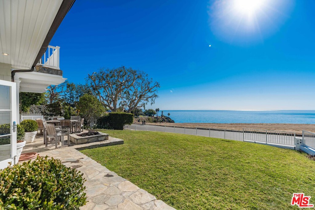 East Coast Traditional Cape on the coveted Via de La Paz bluffs with unobstructive ocean views from Malibu to Catalina Island on a corner lot. Cooks kitchen w/SS appliances, center island w/breakfast bar, built in work desk & breakfast area. The kitchen flows into a great room w/FP, built in cabinetry & French doors to the front patio w/firepit. The dining room & living room w/coffered ceilings & FP are perfect for large gatherings. Upstairs Master bedroom includes an ensuite spa bath, FP, dual walk in closets, adjoining office & French doors that open to a large private balcony to enjoy the sunsets. The second bedroom has French doors that open to a private balcony & shares a bathroom with the third bedroom. Laundry room upstairs. The fourth bedroom with ensuite bath, powder room & mud room complete the first floor. Finished garage with powder room & an outside shower. Hardwood floors throughout the house & freshly painted inside/outside. Close to the Pacific Palisades Village.