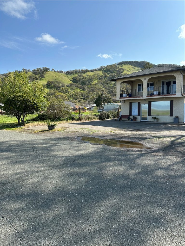 Exceptional Residential & Commercial Opportunity with Expansive Corner Lot and Stunning Lake Views
This unique property presents a rare chance for both residential and commercial use, complete with a large corner lot ( separate address ) and breathtaking lake and mountain views. Step onto the veranda to soak in the serene scenery—an ideal place to unwind with your favorite beverage. Located just steps from the lake, this property offers endless potential.
Main Residence (Upstairs)
Features a spacious open-concept layout with 2 bedrooms and 2 bathrooms. The chef-inspired kitchen includes granite countertops and a generous island, perfect for preparing gourmet meals. The living area boasts vaulted ceilings and panoramic views from every window. The primary suite offers a walk-in closet and private en-suite bathroom, while a second bedroom and full bathroom provide comfortable accommodations for guests. A separate laundry room adds extra convenience.
Commercial Space (Downstairs)
The lower level includes a versatile commercial storefront with three rooms, a kitchen, and a full bathroom—plus access to a private backyard patio. The main entrance faces the street and offers direct views of the lake. Two additional half-bathrooms are located outside for customer or client use.
Two water meters for separate residential and commercial use
Attached 2-car garage with extended driveway
The area is rich with amenities, including boating, watersports, fishing, parks, live music, and community events.