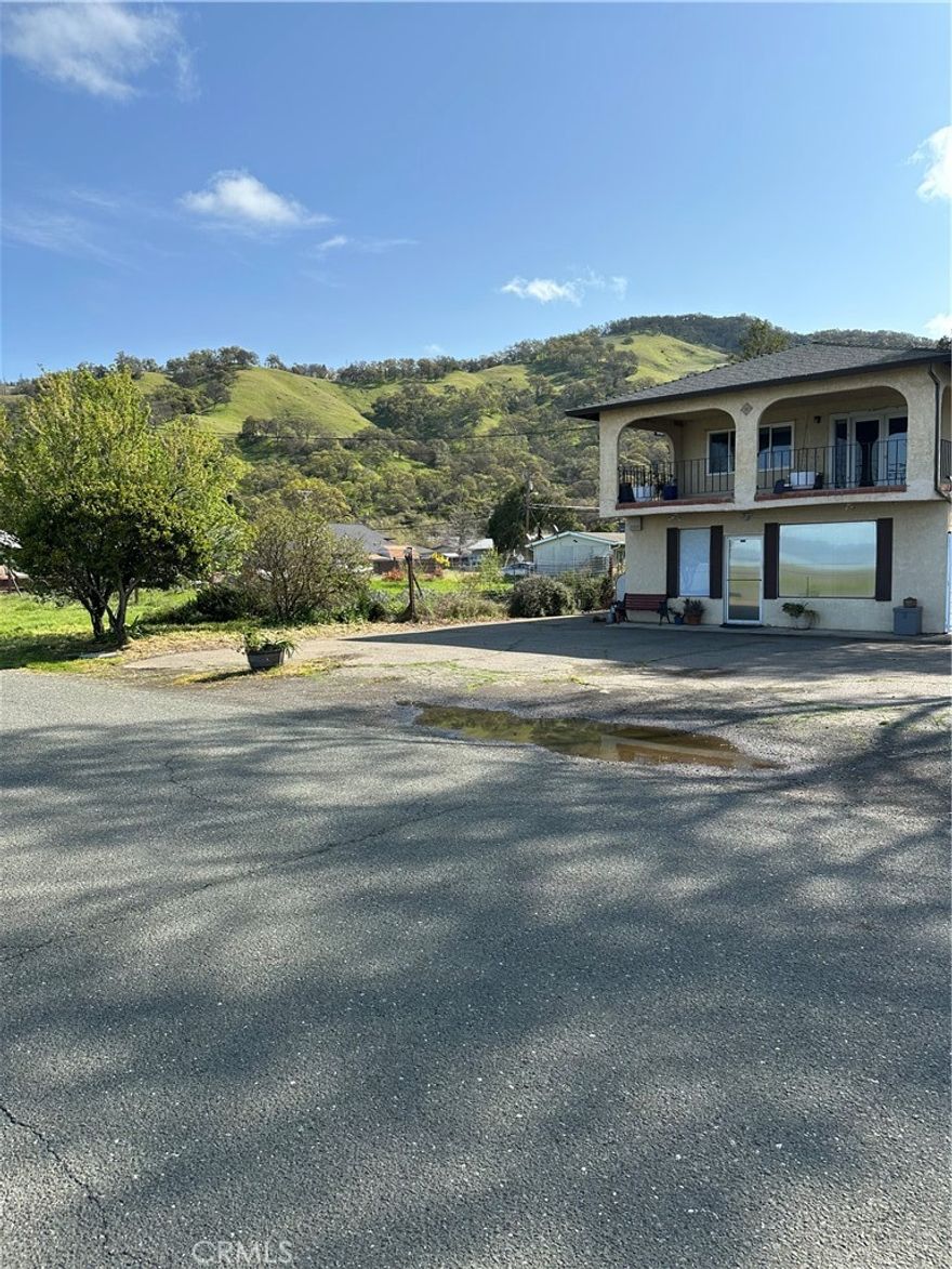 Exceptional Residential & Commercial Opportunity with Expansive Corner Lot and Stunning Lake Views.
Possible seller financing! 
This unique property presents a rare chance for both residential and commercial use, complete with a large corner lot ( separate address ) and breathtaking lake and mountain views. Step onto the veranda to soak in the serene scenery—an ideal place to unwind with your favorite beverage. Located just steps from the lake, this property offers endless potential.
Main Residence (Upstairs)
Features a spacious open-concept layout with 2 bedrooms and 2 bathrooms. The chef-inspired kitchen includes granite countertops and a generous island, perfect for preparing gourmet meals. The living area boasts vaulted ceilings and panoramic views from every window. The primary suite offers a walk-in closet and private en-suite bathroom, while a second bedroom and full bathroom provide comfortable accommodations for guests. A separate laundry room adds extra convenience.
Commercial Space (Downstairs)
The lower level includes a versatile commercial storefront with three rooms, a kitchen, and a full bathroom—plus access to a private backyard patio. The main entrance faces the street and offers direct views of the lake. Two additional half-bathrooms are located outside for customer or client use.
Two water meters for separate residential and commercial use
Attached 2-car garage with extended driveway
The area is rich with amenities, including boating, watersports, fishing, parks, live music, and community events.
