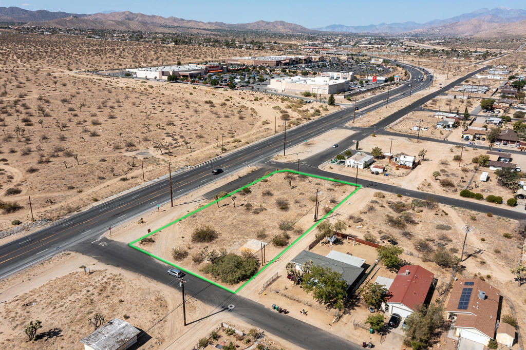 Prime Hwy 62 Frontage! Incredible Investment Opportunity - Rare chance to own 4 contiguous lots totaling approximately 32,300 sq. ft. in the heart of Yucca Valley's bustling commercial corridor. Located directly across from major national retailers and shopping centers, this property boasts exceptional visibility and accessibility with two corner locations providing entry from both Indio Avenue and Richard Drive. APN's: 0601-163-01, 0601-163-02, 0601-134-12, 0601-134-13. Flat & buildable with highway frontage. Utilities/Power available. High traffic counts and excellent exposure. Ideal for developers, investors, or businesses seeking prime frontage. Owner requires all 4 lots sold together. With its location, accessibility, and development potential, this property represents a rare opportunity in a highly desirable and fast-growing area of the Hi-Desert.