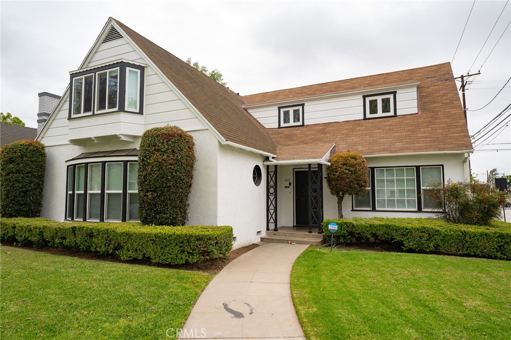 CHARMING AND SPACIOUS DETACHED SINGLE-FAMILY HOME ON A CORNER LOT WITHIN THE WELL-MAINTAINED STREET OF WASHINGTON SQUARE! The home includes original wood flooring, dual pane windows throughout allowing plenty of natural light inside, with modern roller shades, recessed lighting, and plenty of storage spaces throughout. The living room includes a wood-burning fireplace, perfect to cozy up to on those cold evenings. There is a separate family and dining room. The kitchen is upgraded with a newer fridge - NO LONGER SUBZERO FRIDGE AS SHOWN IN PHOTOS, chef's gas stove and cooktop with 6 burners, quartz countertop with matching backsplash, cabinets with plenty of storage space. The first level includes a generous size bedroom and a full bath right outside + a bonus room adjacent to the living room with a sliding pocket door for privacy that can be used as another bedroom or office. The 2nd floor has 3 spacious bedrooms and 2 baths. Separate laundry room for side-by-side washer and dryer. The backyard is hardscaped throughout for ease of maintenance and great place when entertaining guests. Located in the popular Washington Square neighborhood and within walking distance to Santa Ana College, Orange County School of Arts, Downtown Santa Ana with plenty of hip restaurants, bars, retail spots and more. Nearby to the Metrolink / Amtrak Station and a short drive to the South Coast Metro area. Easy access to the 5 and 55 freeways.
