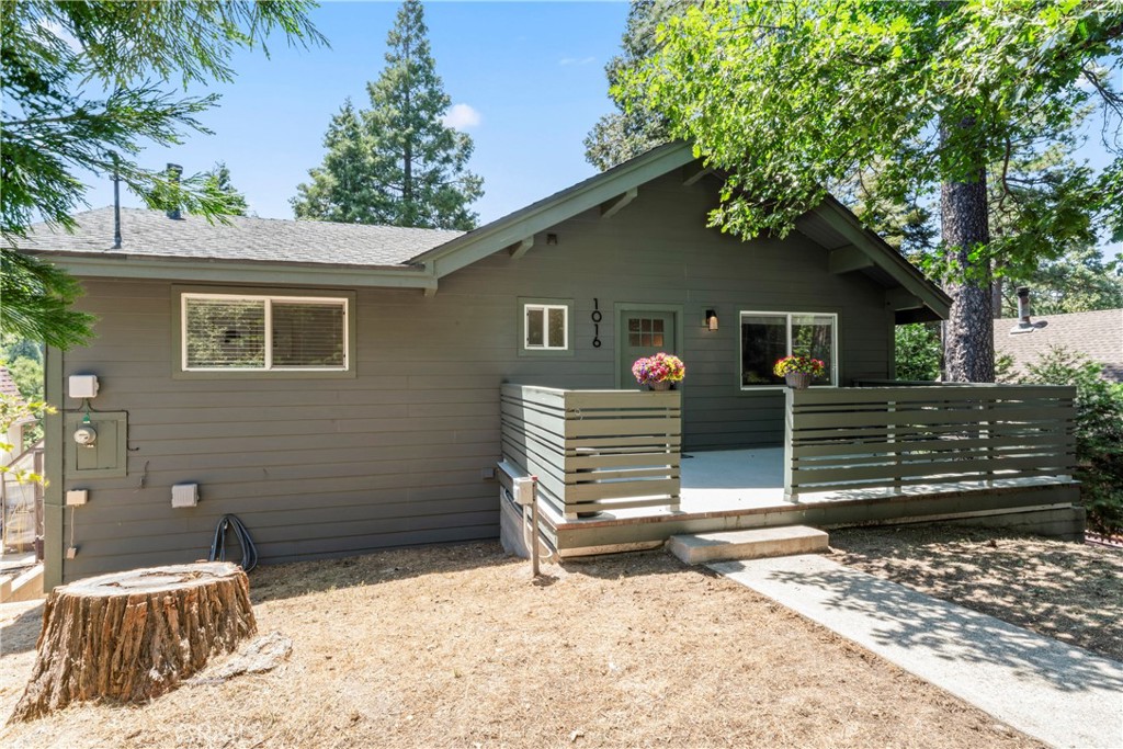 Discover this professionally designed and decorated 4 bedroom 3 bath mountain home, near Lake Gregory and town. This respite features a main floor bedroom and bath, with a gorgeously tiled walk-in shower. Nestled among the cedars, pines, and oaks, this (available) turnkey home offers a cozy fireplace, custom cabinetry, elegant stone counters, custom fixtures, and tasteful decor throughout. Central heat and (mini-split) air provide year-round comfort while a newly refreshed parking area offers three car parking for easy access. The expansive back deck provides a relaxing space to immerse yourself in nature. Ideal as a full-time residence, vacation getaway, or income property. This move-in ready retreat is close to Lake Gregory, the village, and hiking trails offering the best of mountain living. Don't miss your opportunity to tour this one-of-a-kind property!