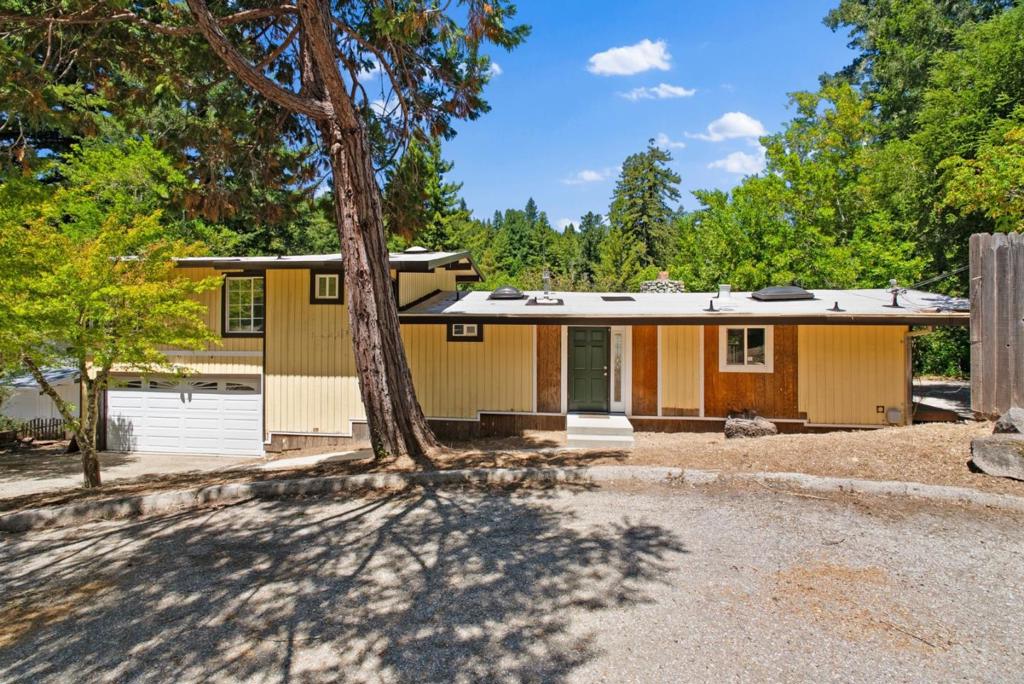 Located in the Forest Hills community of Boulder Creek, this home sits among the redwoods with views of the mountains and San Lorenzo River. Vaulted ceilings and large windows fill the space with natural light. The layout includes a primary suite upstairs and two additional bedrooms on the main level. This property could be a peaceful retreat, weekend getaway, or full time residence in a beautiful natural setting.