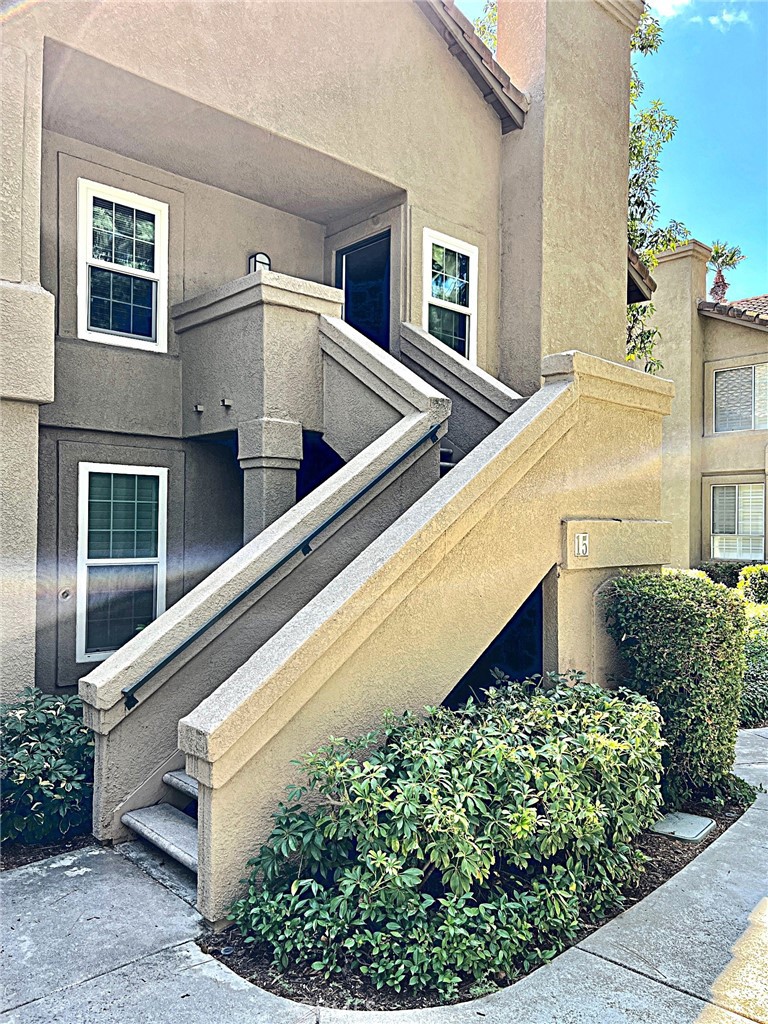 Desirable upper-level End unit in the Calabria Community. Light and Bright. Spacious two bedrooms and two full baths, well-designed floor plan with fridge and washer, and dryer included in a separate area with plenty of storage cabinets. The main living area has high vaulted ceilings, numerous windows, a fireplace, and a dining area with direct access to the large private patio. The kitchen features a gas range, stainless steel refrigerator, microwave, including multiple countertop spaces, and is open to the main living areas. Wood floor style throughout. The master bedroom offers a master bath with dual vanities, sinks, and a large, mirrored closet. Enjoy direct access from the private single-car garage. Great location, walking paths with amenities. Community pool, spa, plenty of guest parking, and all the fantastic amenities Aliso Viejo Community Association has to offer, including numerous parks, community events, and award-winning schools. Walking distance to Aliso Viejo Town Center with lots of shopping choices, dining, theaters, and entertainment, and close to the local Library and Aliso Viejo Ice Palace and Ice Skating. Minutes from beaches and shopping areas. Excellent HOA amenities include a sparkling pool and spa, a BBQ area. With its central location near top schools, shopping, dining, and just minutes from the coast, this home is an ideal blend of comfort and lifestyle. The community of Calabria is just a short distance from the 73-toll road.