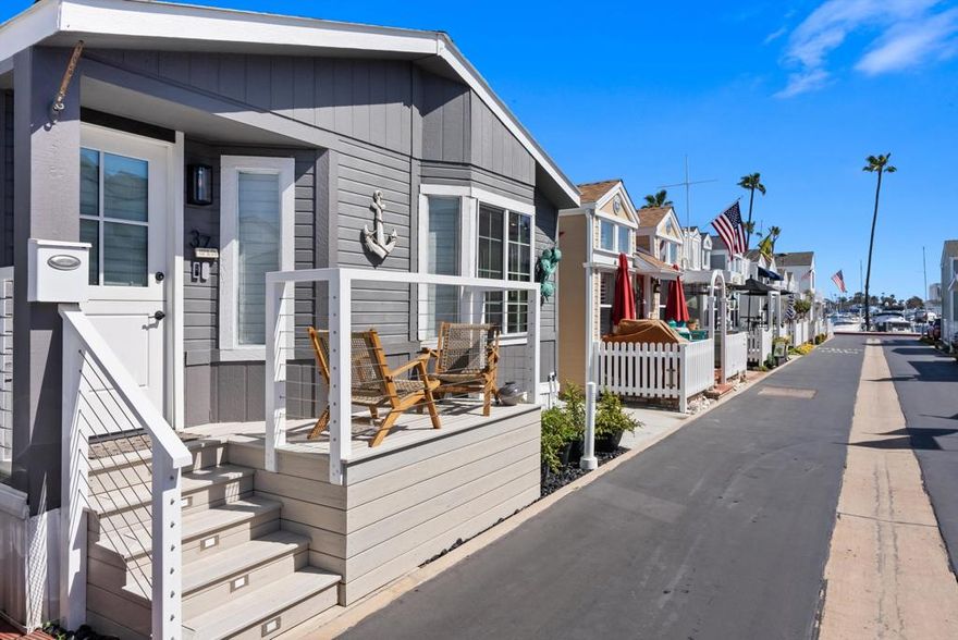 Stunning Beach Cottage in exclusive Lido Peninsula Resort - Your Dream Coastal Retreat Awaits! Welcome to Newport Beach living at its finest. This fully remodeled beach cottage is the turnkey getaway you've been waiting for. Designed with style and sophistication, no detail was overlooked in this exquisite renovation. Step inside to discover luxurious custom finishes, including: Sleek Quartz countertops, Elegant backsplash, Rich white oak floating shelves and Beautifully crafted cabinetry throughout. The chef's kitchen is a showstopper, featuring top-of-the-line Bosch appliances that combine performance with modern design. Enjoy water views from your dining area--perfect for serene mornings and vibrant sunsets. The cozy fireplace adds warmth and charm for cool coastal evenings, while remote-controlled window coverings offer both privacy and convenience with the touch of a button. The spa-inspired bath features designer finishes, creating a peaceful sanctuary right at home. Move-in ready - just bring your flip-flops!Resort Amenities (included with monthly land lease of $3,463/month): Private beach access, Pool & spa, Clubhouse, Gym and very Low property taxes. Steps to fine dining, shopping, and entertainment. Whether you're looking for a full-time residence or a weekend getaway, this home is more than just a property--it's a lifestyle. Ready to live your coastal dream?Welcome home to Lido Peninsula.