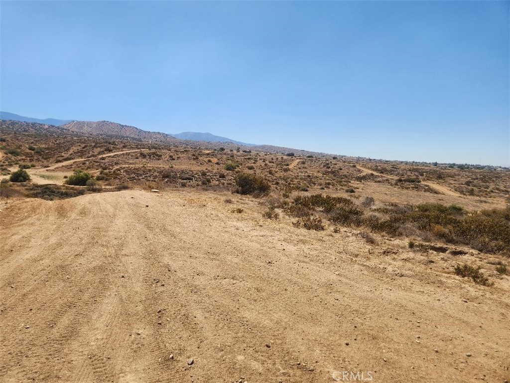 Enjoy the BEAUTIFUL VIEW on this south side location! This could be your dream home location secluded in the high desert. This 5 acre parcel is ready for you! Don't miss this investment opportunity. Located in the Snowline School District.