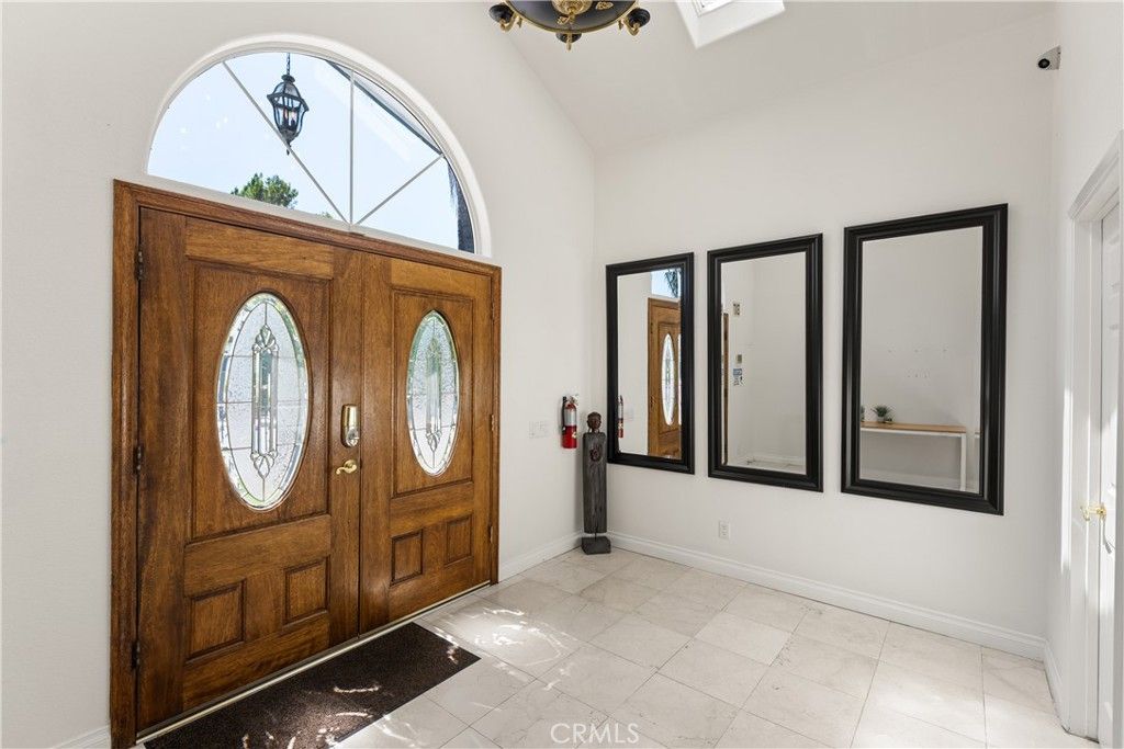 Photo of 18841 Pasadero Drive, Tarzana, CA 91356 (MLS # SR26066128)