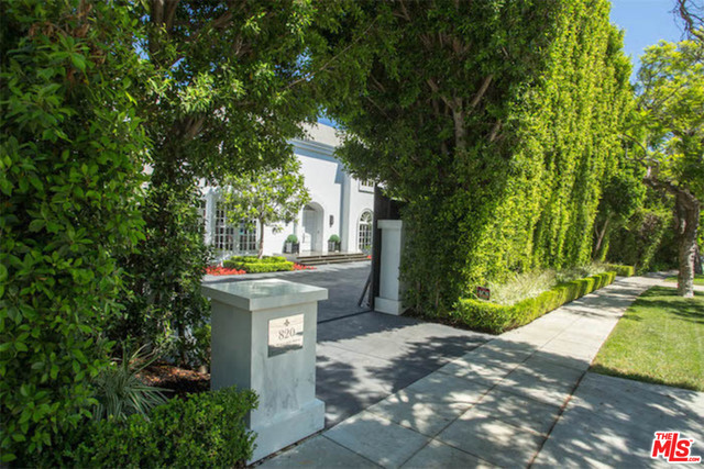 The Height of Style. French Modern Estate on Prime Block of Beverly Hills Flats. Renovated in 2015. Private behind large gates with spacious motor court on over 22,000 sqft lot. Appx 9,200 sqft home with spectacular floor plan and high ceilings throughout. 2 story marble entry with skylight. Gracious living room with fireplace looks out through french doors onto vast grassy backyard punctuated by specimen olive trees. Formal dining for 10+ adjacent to walk-in wine cellar. Large gourmet island kitchen with premium appliances opens to family room, and onto grounds and pool beyond. Master suite with fireplace offers dual baths clad in book matched marble. 4 additional bedrooms upstairs, all with en-suite baths. 2 powder rooms, gift wrapping room, Crestron home automation, and full video security complete this turn-key family estate.