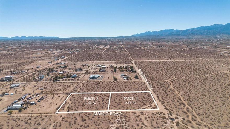 Discover a rare offering in the peaceful high-desert landscape of Phelan: 5.06 acres across two contiguous parcels, each spanning 2.53 acres. Set near the quiet intersection of Marco Road and Sonora Road, this property delivers open desert views, wide horizons, and a serene sense of space that is increasingly difficult to find.  The land is flat and usable, creating an ideal foundation for a custom home, ranch retreat, or a thoughtfully designed desert getaway. The natural surroundings offer a striking backdrop of mountains and desert sky, while still providing convenient access to the amenities of Phelan’s town center. The property is also located within the highly regarded Snowline Unified School District.  Zoned vacant residential, the acreage offers flexibility for a variety of uses. Electricity is nearby, and public water is available in the area. A fire hydrant sits at the corner of Sonora and Lindero, ~330 feet south of Parcel 1, which is the connection point for accessing the water line. Septic systems are commonly used for properties in this area.  Whether you envision a peaceful homestead, a modern desert build, or simply a long-term hold in a growing community, these side-by-side parcels present a compelling opportunity.  Two parcels sold together: APN 3097-221-16-0000 — 2.53 acres and APN 3097-221-17-0000 — 2.53 acres.   A rare chance to claim over five acres of prime, usable desert land with endless possibilities.