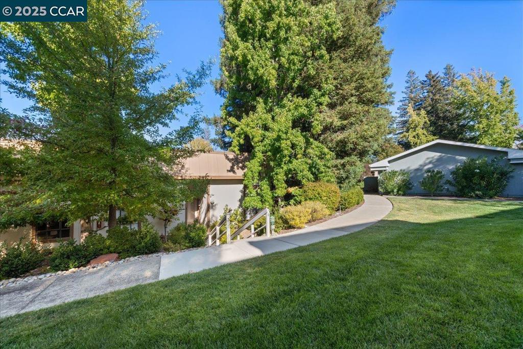 Nestled peacefully among majestic Redwoods, Oaks, and Birch trees, this end-unit Piedmont Townhouse offers the perfect blend of elegance and tranquility. Enjoy serene views from both levels and relax on two spacious balconies surrounded by nature’s beauty. Inside, discover a beautifully updated home with smooth ceilings and luxury appointments, featuring a spacious primary suite, two inviting guest rooms, one a convenient first-floor bedroom suite with full bath and level access. The modern kitchen and baths have been tastefully refreshed, complemented by newer flooring, stylish finishes and a sophisticated yet cozy ambiance throughout. Experience the vibrant Rossmoor lifestyle, where every day feels like a getaway! With over 225 clubs, championship golf, pickleball and tennis courts, lawn bowling, hiking trails, swimming pools, and more, your next chapter of active, enjoyable living begins here.