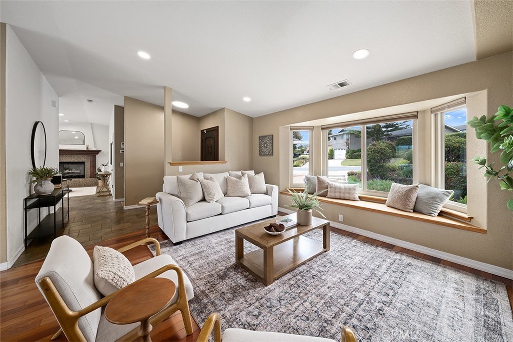 Welcome to 328 Valley View Drive in Pismo Beach, CA! Discover coastal living at its finest in this beautifully appointed 3-bedroom, 2.5-bath home nestled in one of Pismo Beach's most desirable neighborhoods. Spanning 2,117 square feet, this thoughtfully designed home offers comfort, style, and endless opportunities for outdoor living. From the moment you arrive, you’re welcomed by a charming entry courtyard surrounded by low-maintenance landscaping, a peaceful spot to enjoy your morning coffee or evening sunsets. On the main level, enjoy an open and airy living space featuring vaulted ceilings, rich cherry wood floors, a cozy dining nook, and a separate family room with fireplace. The chef’s kitchen features ample wood cabinetry, high-end stainless steel appliances, granite countertops, glass tile backsplash, durable tile flooring, a skylight, and a large picture window with breathtaking views of the adjacent oak woodlands. Downstairs, you will find two comfortable guest bedrooms and a recently updated full bath with a quartz dual vanity and soaking tub. Just down the hall is the primary suite, featuring a sizable walk-in closet and a remodeled ensuite bathroom with custom tiled shower and white marbled quartz double vanity. Step just outside to your private covered deck that overlooks the spacious, tree lined yard. The lush backyard is a serene escape, with towering queen palms, two lawn areas, fruit trees (including apple and plum), and a concrete patio suited for a spa. The expansive upper deck, made with low-maintenance composite materials, provides panoramic views of nearby hillsides and old growth oak trees behind the home. At the front of the home is an oversized two-car garage with work bench, built-in cabinets for storage, and full size windows that provide natural light. Just inside from the garage is a dedicated laundry room with pet door, and a powder room. Located in a well-kept neighborhood that enjoys the Central Coast’s temperate Mediterranean climate, this property is just minutes from beaches, hiking trails, downtown Pismo Beach, and the nearby towns of San Luis Obispo, Avila Beach, and Arroyo Grande. Don't miss this opportunity to live the beach lifestyle on the Central Coast.