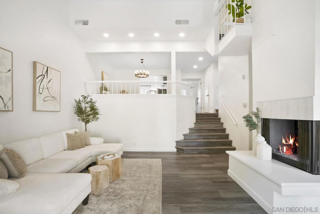 Beautifully updated end-unit townhome in Eastbluff, tucked away from road noise and traffic, flooded with natural light and ocean breezes, offering the rare blend of designer updates, prime location, and below-market pricing. Features include an open kitchen with redesigned layout for enhanced flow, newly renovated bathrooms with designer finishes, updated fireplace surround with quartz hearth, new hardware and lighting, popcorn was removed long ago and recessed lighting added to main living areas and kitchen, hard-surface flooring in main areas, newer windows with plantation shutters, and brand new AC unit, plus recently replaced plumbing throughout the home. Every upgrade has been done with quality and longevity in mind. Additional highlights include new carpet in upstairs bedrooms, custom closet in primary bedroom, and a private gated patio surrounded by mature hedges for the ultimate privacy. Eastbluff community amenities include two pools, spas, and a clubhouse, with HOA dues covering water, trash, sewer, roof, exterior maintenance and landscaping, and termite service. Conveniently located with easy freeway access that avoids high traffic areas, while still very close to shopping, restaurants, La Jolla Village, UTC, UCSD and area beaches.