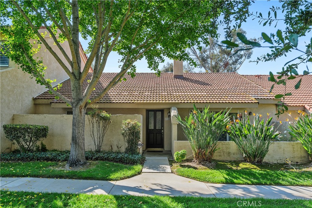 You'll love this beautifully maintained rare single-story condo in the gated Park Granada community! Offering 1600 sq ft. with 2 spacious bedrooms, 2 bathrooms with Primary bath tastefully remodeled, Large kitchen with center island, Stainless Steel appliances, farm sink and lots of cabinets space. Living Room includes 2 ceiling fans with vaulted ceilings, convenient Laundry room, fireplace and 3 private patios with sliders. View of lush green space and pool outside front slider. All Blinds and drapes included. Energy-efficient upgrades include dual pane windows, all new ceilings fans in every room, upgraded HVAC, new paneled interior doors, 40-gallon water heater, newer roof, and new flooring and paint. Tons of storage in the kitchen, hallway and bedrooms. Detached 2-car garage with ample storage just steps away.  Enjoy 3 well maintained swimming pools, 3 spas, and lush greenbelts with full trees and walking paths. Conveniently located near the 91, 60 and 215 freeways, Downtown Riverside, the Riverside Plaza, shopping, dining and scenic Victoria Avenue trails. You don't want to miss this gem!