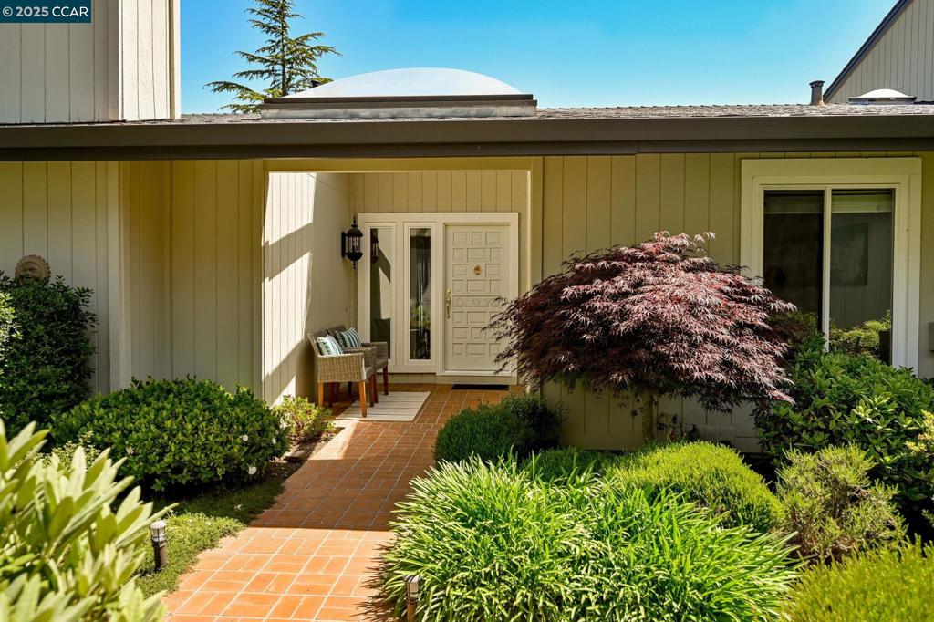 112 Alta Mesa | A Hillside Haven with Beautiful Views Perched atop one of Moraga’s most coveted ridgelines, 112 Alta Mesa Court is more than a home—it’s a lifestyle. With sweeping views of the rolling tree studded hills, this beautifully maintained, single level residence offers space, serenity, and timeless California charm. This beautifully cared-for, single-level 3BD/2BA townhome offers 1,954 sq. ft. including open-concept spaces, cozy gas log fireplaces, high ceilings, skylights, and a private back deck perfect for morning coffee or sunset unwinding. Inside, you'll find updated flooring, fresh paint, dual-pane windows, and thoughtful touches throughout—including a spacious laundry room, dual pane windows and built-in cabinets. Step outside to a vibrant garden, or head just a few steps to the community pool and tennis courts. Convenient 2 car detached garage a few steps from front door. Located minutes from trails, parks, top-rated schools, and Moraga’s popular Moraga Commons and Farmers’ Market, this home offers the perfect blend of nature and convenience. Come see the views, feel the serenity, and imagine life elevated at 112 Alta Mesa Ct in popular Moraga Ridge.