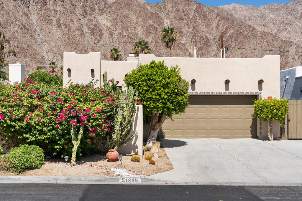 Experience the Best of Desert Living in This Santa Fe-Style Pool Home in La Quinta Cove!Embrace the charm of the Southwest in this beautifully updated property, ideally located in the heart of La Quinta Cove. Nestled against the stunning Santa Rosa Mountains, this property offers ultimate privacy and breathtaking views from a gated courtyard oasis.Step into a thoughtfully landscaped desert retreat featuring a vibrant mix of mature cacti, orange tree, and fragrant jasmine. The Pebble-Tec pool and spa with a cascading waterfall and expansive tanning shelf create the perfect setting for relaxing or entertaining.The wraparound courtyard leads to additional outdoor living spaces, including a gas BBQ hookup and a covered back patio with Alumawood shade--ideal for entertaining and soaking in mountain views.Inside, the home boasts adobe-style accents and warm, earthy tones that reflect the spirit of the desert. The open-concept living area features high ceilings, a cozy fireplace, and abundant natural light through glass sliders and transom windows. The connected kitchen, dining, and living area are adorned with authentic Saltillo tile floors and handcrafted Talavera tile details that add character and artistic flair.With three spacious bedrooms--two offering large walk-in closets and direct outdoor access--this home is as functional as it is beautiful. The primary and secondary bedrooms welcome in additional light and desert breezes, creating a peaceful retreat.Perfect as a full-time residence, vacation home, or income property. This home is just a short walk to the scenic Fred Wolff Bear Creek Trail and minutes from the charm of Old Town La Quinta. Enjoy nearby shopping, dining, the La Quinta Wellness Center, and Fritz Burns Park, home to pickleball and tennis courts.Golf enthusiasts will love the proximity to the La Quinta Resort & Club and public access to five championship golf courses, including the PGA's Mountain, Dunes, Stadium, Greg Norman, and Nicklaus Tournament courses, plus SilverRock's Arnold Palmer Classic Course.Don't miss this opportunity to own a piece of desert paradise in one of La Quinta's most sought-after neighborhoods.