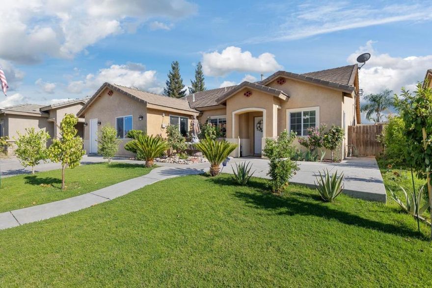 Upon entering this lovely 3 bedroom, 2 bath home, you'll be welcomed by high ceilings and a spacious formal living room that seamlessly transitions into the dining area. This home boasts tile flooring throughout. The kitchen is equipped with a large breakfast bar offering ample seating space, complemented by granite countertops, a mosaic tile backsplash, and stunning white cabinetry for all your storage needs. The main living room is bright and airy, filled with natural light. The primary bedroom features an ensuite bathroom with dual sinks, a walk-in shower, and a separate soaking tub while the remaining bedrooms are all a great size for kids, guests, or office space. The backyard is an entertainer's dream, with a large patio area and a luxurious pool for hosting year-round. This home also includes a 2 bedroom, 1 bath ADU unit that was converted from the garage that can be used as a home office, granny unit or income producing unit. Complete with a full kitchen, featuring gorgeous backsplash and countertops, a bathroom with a walk-in shower.