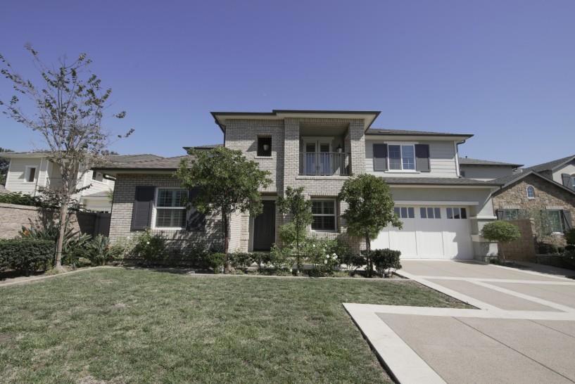 A striking Huntington Beach retreat awaits with 6 bedrooms, 5.5 baths, and 4,786 square feet of beautifully appointed living space. Step inside and youll be greeted by a grand living area where sunlight filters through plantation shutters. Your kitchen is designed to impress, with custom cabinetry, a vast island wrapped in elegant countertops, and stainless steel appliances. Sliding glass doors extend your living experience to a landscaped backyard. An upstairs loft provides another refined gathering space. Meanwhile, each of the six bedrooms provides a haven of privacy, none more so than the expansive main suite. Here, youll enjoy a luxurious ensuite bath with a soaking tub, dual vanities, and a generous walk-in closet. Four and a half additional baths and a well-placed laundry room ensure comfort and convenience throughout. A 1-car garage completes the home. This address places you in Huntington Harbour, just minutes from Bolsa Chica State Beach, Trader Joes, Ralphs, and an array of fine dining along Pacific Coast Highway. Whether strolling the sand or exploring local boutiques, youre surrounded by sophistication at every turn. *Fireplace is for decorative use only and cannot be used without consent from Belong.