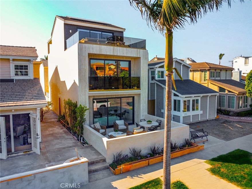 Huge price reduction!  Experience the pinnacle of coastal elegance in this stunning brand-new beach estate, perfectly situated in the heart of Downtown Huntington Beach. Encompassing 2,857 square feet, this meticulously designed residence harmoniously blends sophisticated style with high-end functionality.

Featuring three luxurious en-suite bedrooms, a spacious family lounge, and a remarkable third-floor luxury suite with an expansive deck, this home is ideal for modern living and entertaining. The expansive great room invites the refreshing coastal breeze through wide LA Cantina doors, showcasing sleek porcelain flooring and striking custom tilework.

The chef’s kitchen is a culinary delight, boasting a grand island with Calcutta Turquoise countertops, an Onyx Velluto backsplash, and premium appliances. The primary suite offers a serene retreat, complete with a private balcony, spa-inspired bathroom, and a custom walk-in closet.

Additional highlights include a finished two-car garage with epoxy flooring and dual rooftop decks featuring breathtaking views. Don’t miss this opportunity to embrace luxurious coastal living in your dream home!