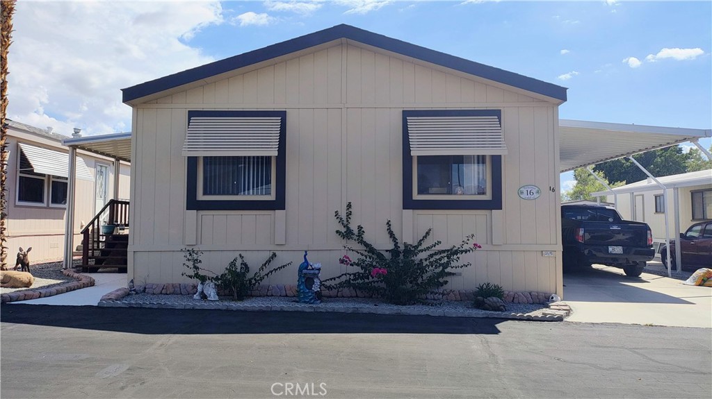 Charming 3-Bedroom Home in 55+ Senior Community at Corkill Palms
This delightful 3-bedroom, double-wide home is located in the vibrant Corkill Palms 55+ senior community, offering a relaxing atmosphere and fantastic amenities, including a hot mineral water pool and spa—known for their healing properties!
Inside, the home features a spacious Living room. The kitchen is a true standout, with updated laminate flooring, recessed lighting, a 5-burner stove, Samsung refrigerator & a convenient sitting bar.
The two large front bedrooms each come with ceiling fans for added comfort. The spacious master bedroom also includes a ceiling fan & a wall-to-wall closet. The master bath is beautifully updated with a Victorian-style vanity, granite countertops, a tiled walk-in bathtub with a shower, linen closets, & updated flooring. This well-maintained home also features a large laundry room at the back entrance with plenty of space for additional storage or customization. The front bathroom has also been updated to match the home's modern charm.
You’ll love spending time on the extra-large, updated front porch—perfect for relaxation. And don't forget the lemon tree just behind it, adding a lovely touch to your outdoor space! With a 3-car covered extended side carport and a shed for additional storage, this home is both practical and inviting. The active Corkill Palms community offers a variety of amenities, including a hot mineral water pool and spa, a large clubhouse with a library and sitting area, a spacious kitchen, billiards room, BBQ area, putting green, and a pond for added relaxation and enjoyment. Home comes partially furnished. The refrigerator is a little over a year old.
This is an opportunity you won’t want to miss!