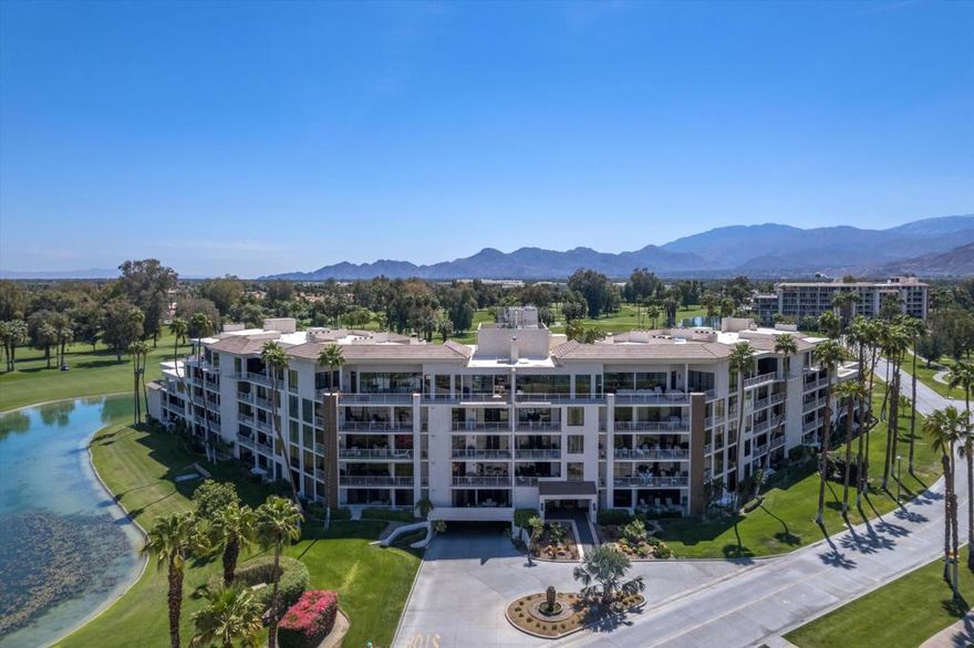 Spacious Luxury Retreat | Desert Island, Rancho MirageExperience refined desert living in this expansive, fully remodeled luxury condo featuring approximately 1,385 sq. ft. of designer interiors and 357 sq. ft. of outdoor living space. Enjoy breathtaking lake, golf course, and mountain views from every angle.The open-concept great room features large format porcelain tile flooring which showcases the floor-to-ceiling glass doors leading to a fabulous balcony--perfect for dining, lounging, and entertaining. Motorized shades in the main living areas and motorized exterior solar shades provide effortless comfort and sun control throughout the day while Lutron lighting provides energy efficiency, enhanced ambiance and smart home automation.The gourmet kitchen impresses with custom cabinetry, quartz countertops, and premium KitchenAid appliances, combining sleek design with practical luxury.Retreat to the spacious primary suite, a serene sanctuary featuring balcony access, heated bathroom floors, a frameless glass shower, Toto bidet, and spa-inspired designer finishes for the ultimate in comfort and sophistication.A cleverly designed flex space adds remarkable versatility--complete with a Murphy bed, discreetly hidden laundry, and built-in vanity. A separate water closet and shower provide full guest bath functionality.Located within the prestigious Desert Island community--a rare mid-rise enclave in Rancho Mirage--residents enjoy 24-hour security, pools, tennis and pickleball courts, a fitness center, paddle boats, and lush walking paths surrounding the private lake.Perfectly positioned across from Sunnylands and near Disney's Cotino community, this exclusive home offers a sophisticated blend of luxury, convenience, and resort-style living--ideal as a full-time residence, vacation retreat, or lock-and-leave getaway. You have to see this to truly appreciate all it has to offer!