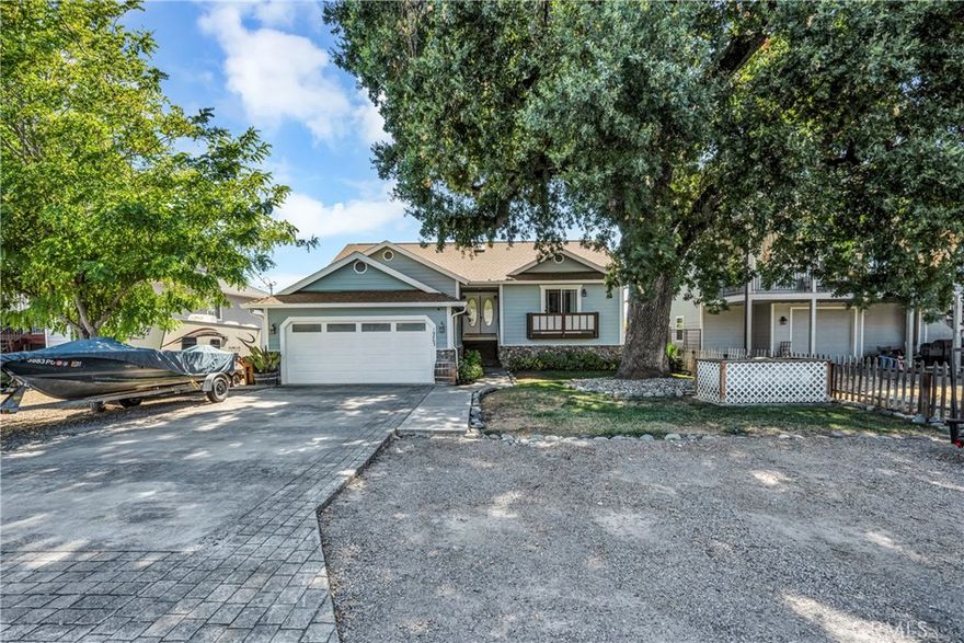 Welcome home to your private retreat! This 3 bedroom, 2 bath gem blends modern upgrades with peaceful surroundings. The heart of the home is the remodeled kitchen with quartz countertops, flowing seamlessly into open living spaces finished with luxury vinyl plank flooring. The primary suite is a spa-like escape with a jetted soaking tub and separate shower.



Step outside to a spacious fenced yard perfect for entertaining, gardening, or relaxing under the covered deck with vineyard and creek views. With raised beds, a storage shed, and no worry of stray golf balls, it’s a rare combination of comfort and privacy. Finally, there’s room for your RV and boat—all just steps from nature. This turnkey property is ready for you to move in and start living your best life.