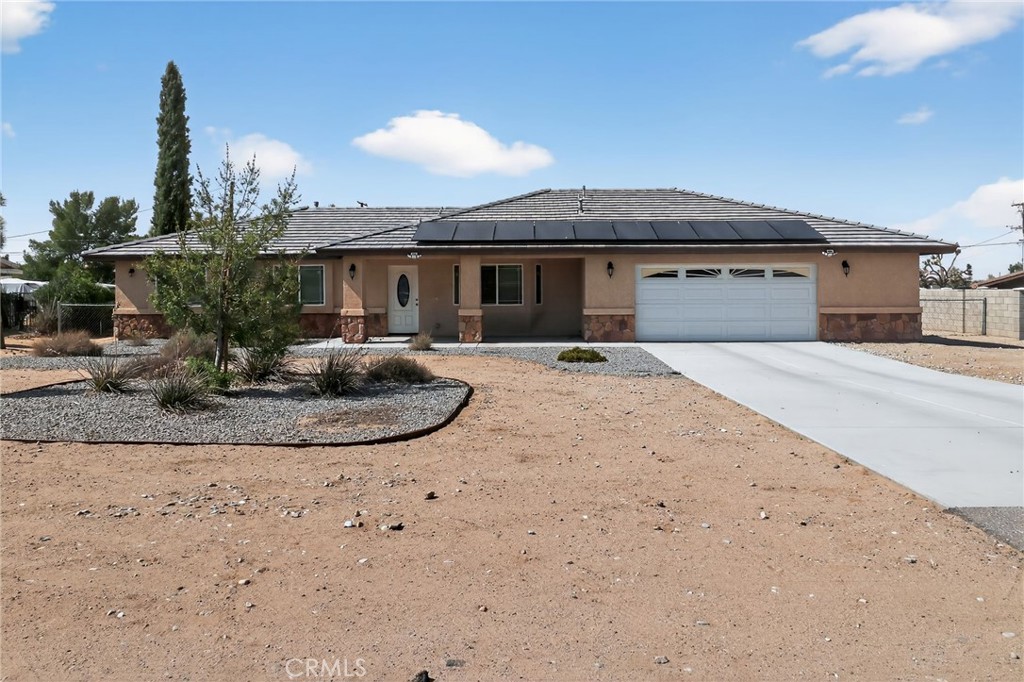 Welcome to this meticulously maintained 4-bedroom, 2-bathroom home in Apple Valley, offered by the original owners. This 1,763 sq ft residence seamlessly blends a cozy "home" feel with modern, high-end upgrades, offering the perfect sanctuary for any family.
Step inside to find durable and clean ceramic tile flooring that flows through the main living spaces. The kitchen is a true centerpiece, boasting sleek granite countertops and ample cabinet space, perfect for preparing family meals or entertaining guests.
The private master suite is a true retreat, featuring a spacious large closet and a spa-like ensuite with a luxurious soaking tub—a perfect place to unwind at the end of the day.
Beyond the home's interior, you'll discover more incredible features. A tankless water heater ensures endless hot water on demand, while the huge, fully insulated garage provides not only secure parking but also a comfortable workspace or storage area year-round.
The outdoor space is an entertainer's dream, with a fully fenced, large backyard that offers a private oasis for kids, pets, and summer barbecues. The space allows for you to Make it your own. The home also comes equipped with an environmentally friendly leased solar system, a valuable feature that helps reduce monthly utility costs.
this is more than just a house—it's a place to call home.