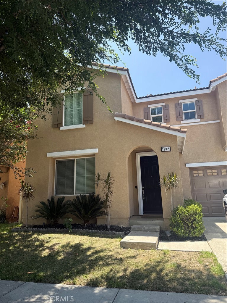 Welcome to gated community of Elm Park! This beautifully maintained 3,054 sq ft residence features a perfect open-concept layout with newer laminate flooring and ample living areas that blend comfort and functionality. The updated kitchen , showcasing granite countertops, freshly repainted cabinets, modern finishes, and a large center island- ideal for entertaining or casual family meals. A convenient downstairs bedroom and full bath offer flexibility for guests or a home office. Upstairs, you'll find a generously sized loft, three additional bedrooms, 2 full bathroom, large laundry room with cabinets and sink, and a luxurious primary suite complete with two walk-in closets and a beautifully appointed en-suite bathroom. All bedrooms are spacious and include ceiling fans for year-round comfort. Step outside to your private backyard retreat-perfect for relaxing, hosting, or enjoying quiet evenings. The community features sparkling pool, spa, picnic area, and playground. Ideally located near shopping, dining, and close proximity to the 210 freeway, this home truly offers the best of comfort, convenience, and community living.
