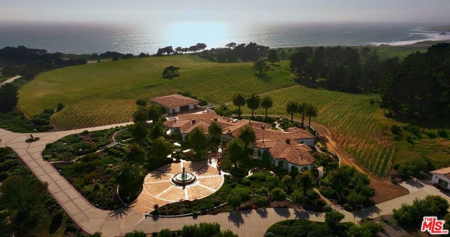 Discover limitless opportunities at Moonstone Ranch Estate, a once-in-a-lifetime 78.5-acre compound opposite the famed Pacific Coast Highway. This bespoke estate offers a multitude of lifestyle possibilities, the unparalleled combination of a luxurious oceanside residence, a private vineyard, and the thrill of horseback riding through both forest and beach landscapes. Moonstone Ranch Estate is more than just a home; it's a sanctuary where you can indulge in the finest aspects of coastal and country living in one of California's most breathtaking and sought-after locations. Accessible via two private entry security gates off Hwy 1, the extensive driveway leads to a stunning main residence boasting interiors of grand scale, bespoke fixtures, and finishes, and an abundance of natural light throughout with picturesque views of the grounds. The property showcases elaborate landscaping with sculptured gardens, Canary Island palms, olive, oak, pine trees, stone statues, and custom bronze urns. Additional amenities include a helicopter landing pad, two fenced pastures ranging from 10 to 20 acres, and 6 acres of irrigated wine vineyards, home to 6,200 Pinot Noir grape vines. Accessory structures include a Pavillion - originally designed to store a full-sized helicopter. The 12,700 sq ft space makes for an incredible event space, equipped with a backroom prep area, an upstairs observation room, an upstairs single apartment, and hookups for motor coaches. Entertain on all scales with the custom Entertainer's Hall. This versatile 4,200 square-foot building boasts an expansive open interior, ideal for a variety of uses. Featuring a full bar and seating area, a convenient half bath, and ample storage space, it offers both functionality and style. Stained concrete floors add a touch of sophistication - perfect for any occasion. One of the standout features of this prestigious property is the unparalleled equestrian lifestyle it offers. For horse enthusiasts, this is a dream come true, providing the perfect setting for riding through scenic trails and along the beach. With miles of forest pathways leading directly to the shore and stable stalls accommodating up to six horses, this property is a true equestrian paradise. Moonstone Ranch Estate offers limitless opportunities with enough acreage for a polo field along the famed Highway 101 coast. This extraordinary property presents the potential for winery ventures, further equestrian activities, and various cash flow opportunities.