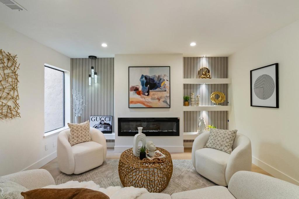 Stunningly fully renovated townhome-style condo nestled in the highly sought-after Orchards community of Fremont. This desirable North East facing residence showcases exceptional pride of ownership and is completely turnkey. The home boasts a modernized kitchen and bathrooms featuring elegant quartz countertops and contemporary finishes. The spacious living and family room areas are enhanced with new flooring, recessed lighting, and a sleek modern fireplace, creating an inviting ambiance. Upstairs, the bedrooms offer custom accent walls and additional recessed lighting for a stylish touch. Enjoy year-round comfort with a brand new AC system and unwind in the beautifully maintained private backyardperfect for entertaining or quiet evenings. Expansive windows fill the home with natural light, highlighting its bright and airy atmosphere. Ideally located near Fremont BART, Lake Elizabeth, premier dining, shopping, and major freeways, this home is a commuters dream. Located in a highly rated school district (buyer to verify), its an exceptional opportunity for families and professionals seeking comfort, style, and convenience in a vibrant neighborhood.