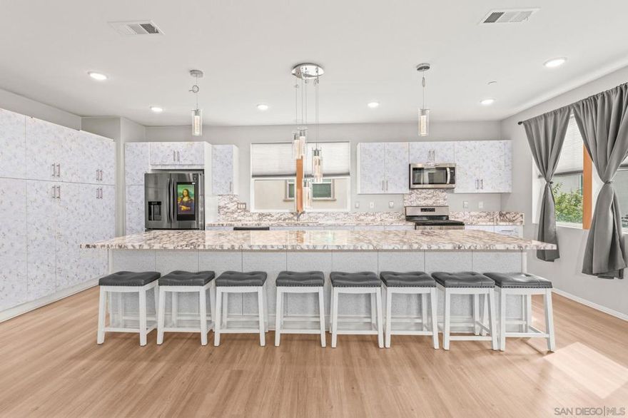 Wonderful value in San Diego! With some light cosmetic fixes, create automatic equity- a fresh coat of paint, new carpet and removing the peel and stick contact paper off the cabinets and countertops, you will have a beautiful new home in the Playa del Mar complex! This three story townhome was built in 2019 and features a two car garage with room for storage and like new epoxy floors. The main living space is large and open concept with a huge island, perfect for entertaining. Once you peel off the contact paper, you will find beautiful quartzite counter tops and white cabinets. On the top floor you will find 3 bedrooms, 2 full sized baths and a stacked laundry closet. The best part of this home are the incredible amenities within the gated complex- resort like pool, spa, outdoor showers, great gym space, locker rooms, BBQ area, club houses, play ground, park and so much more! This home is a must see!